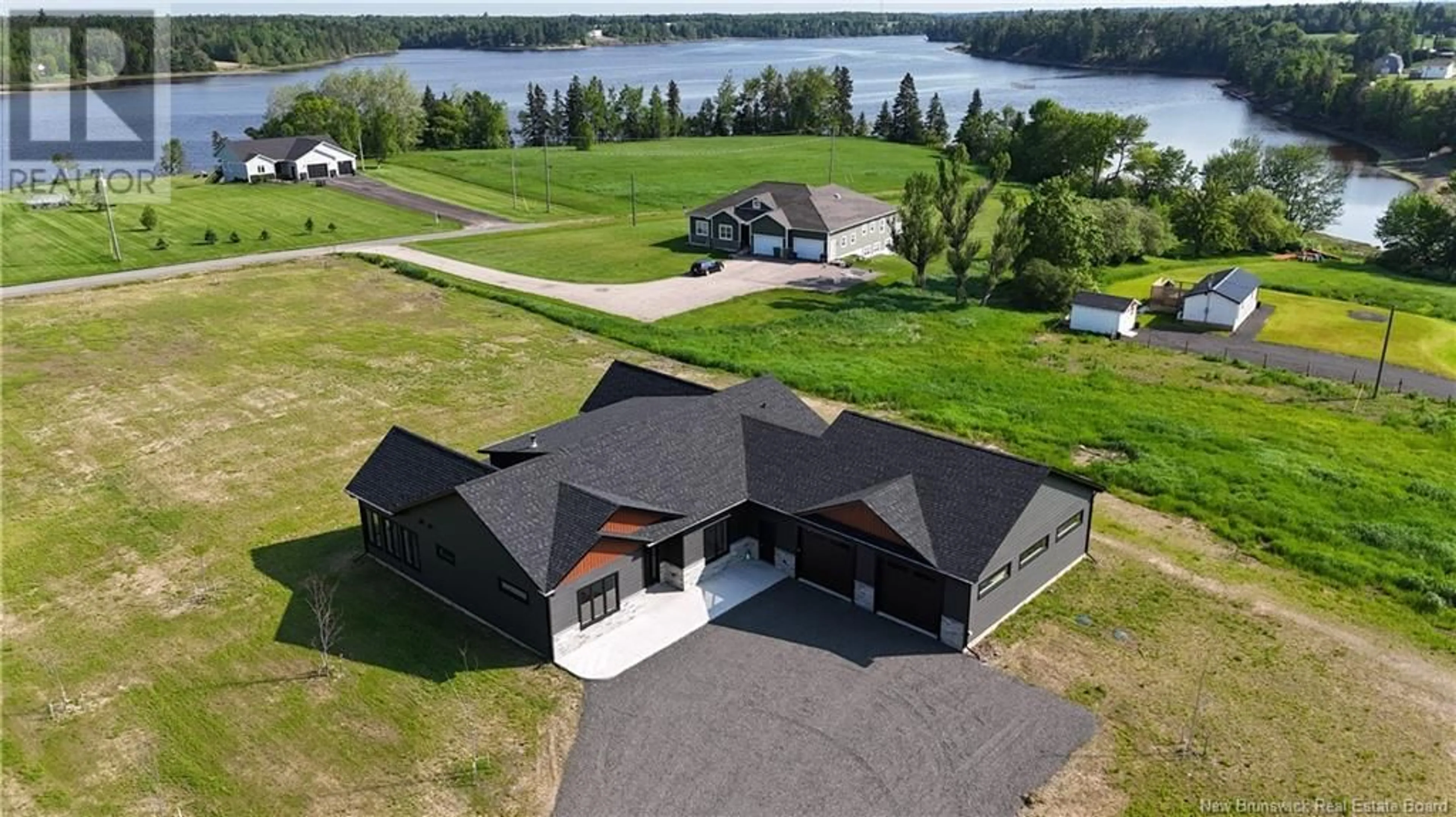 A pic from outside/outdoor area/front of a property/back of a property/a pic from drone, water/lake/river/ocean view for 10 BEAR CREEK LANE, Lower Main River New Brunswick E4T0C3