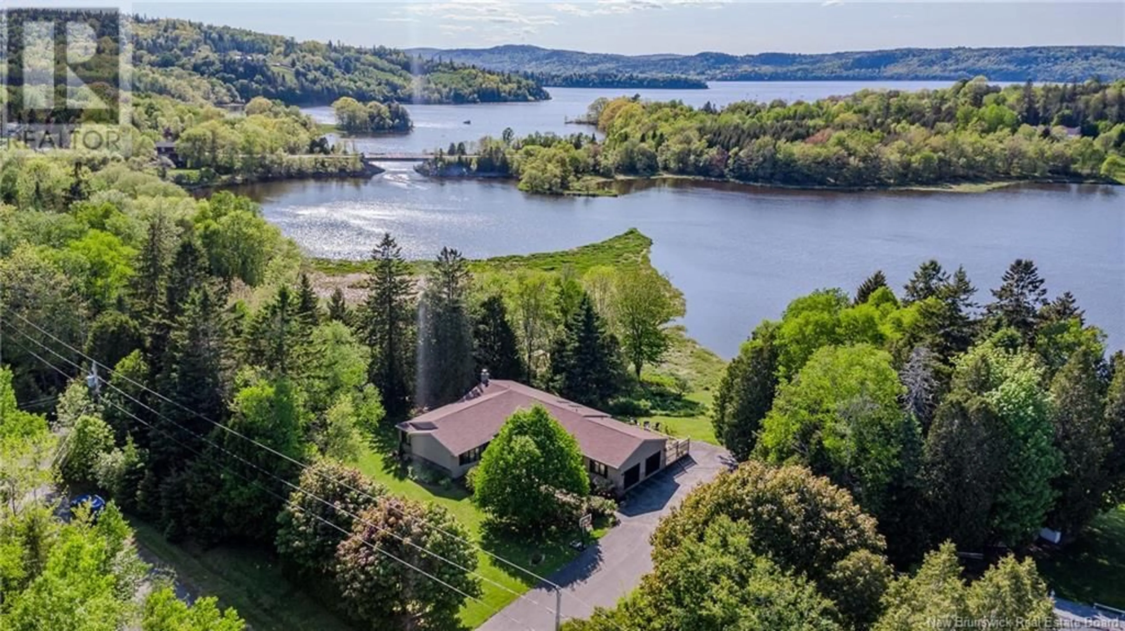 A pic from outside/outdoor area/front of a property/back of a property/a pic from drone, water/lake/river/ocean view for 15 DOUGLAS DRIVE, Quispamsis New Brunswick E2G1Y3