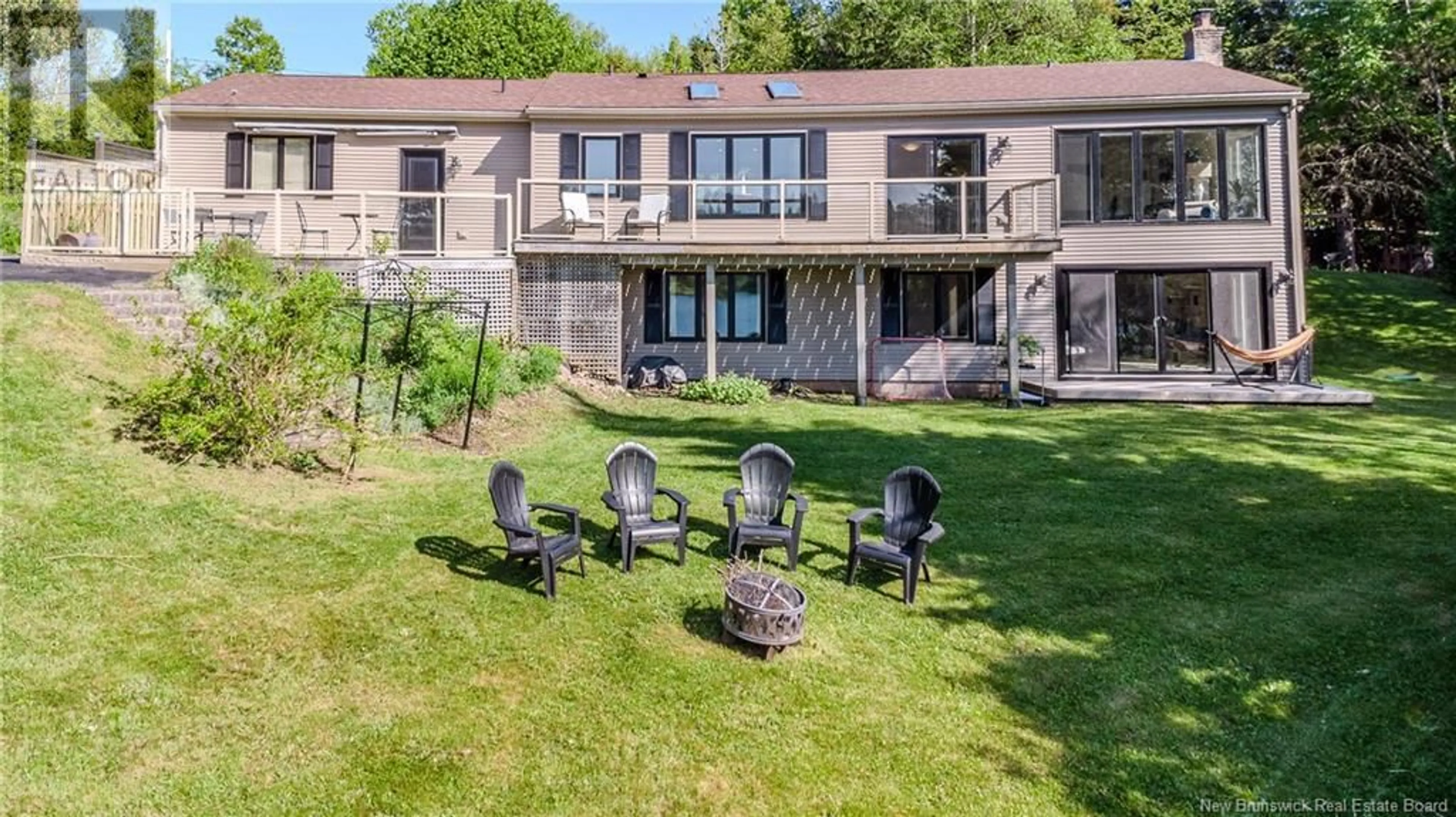 A pic from outside/outdoor area/front of a property/back of a property/a pic from drone, water/lake/river/ocean view for 15 DOUGLAS DRIVE, Quispamsis New Brunswick E2G1Y3