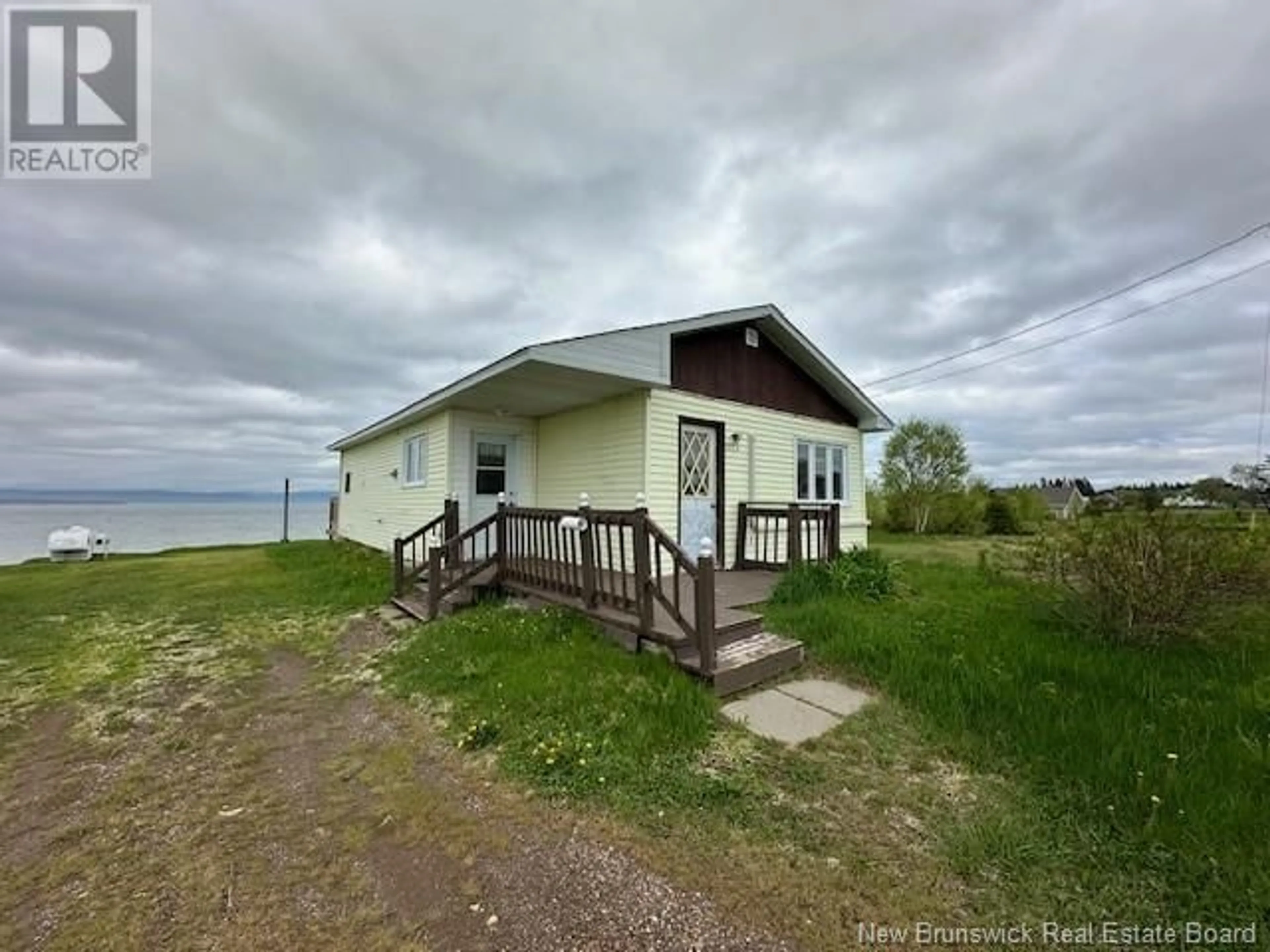 A pic from outside/outdoor area/front of a property/back of a property/a pic from drone, water/lake/river/ocean view for 533 CHALEUR STREET, Charlo New Brunswick E8E2C4