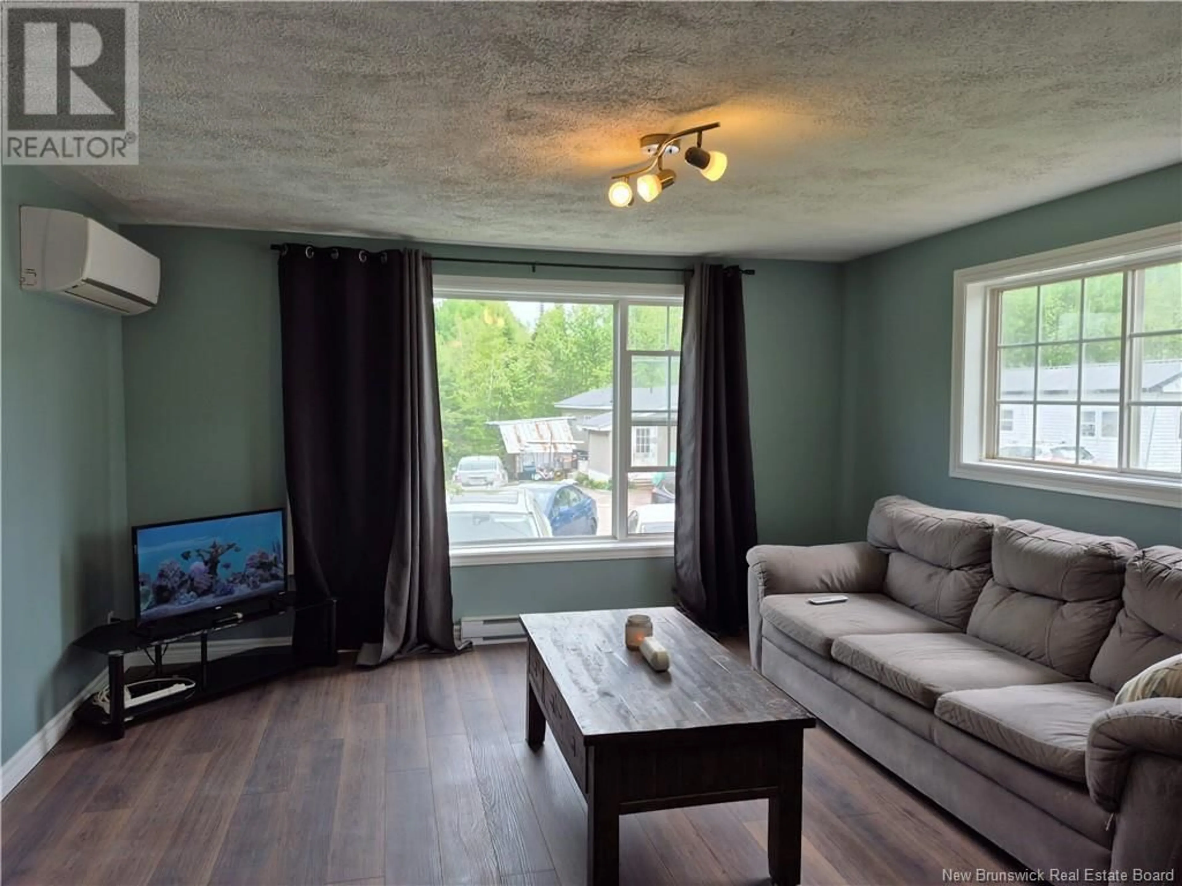 Living room with furniture, wood/laminate floor for 27 RYAN DRIVE, Kingsley New Brunswick E3G6G7