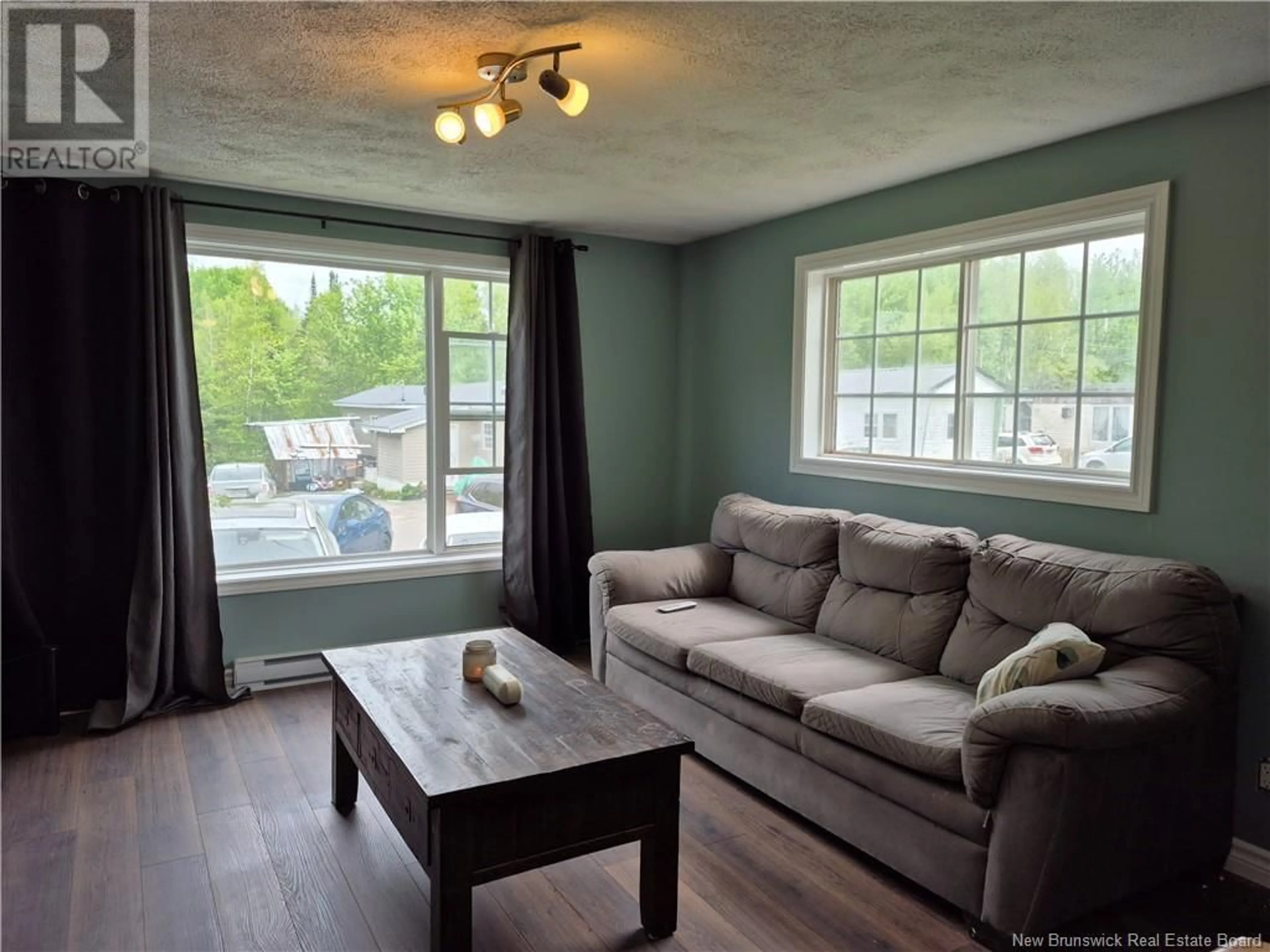 Living room with furniture, wood/laminate floor for 27 RYAN DRIVE, Kingsley New Brunswick E3G6G7