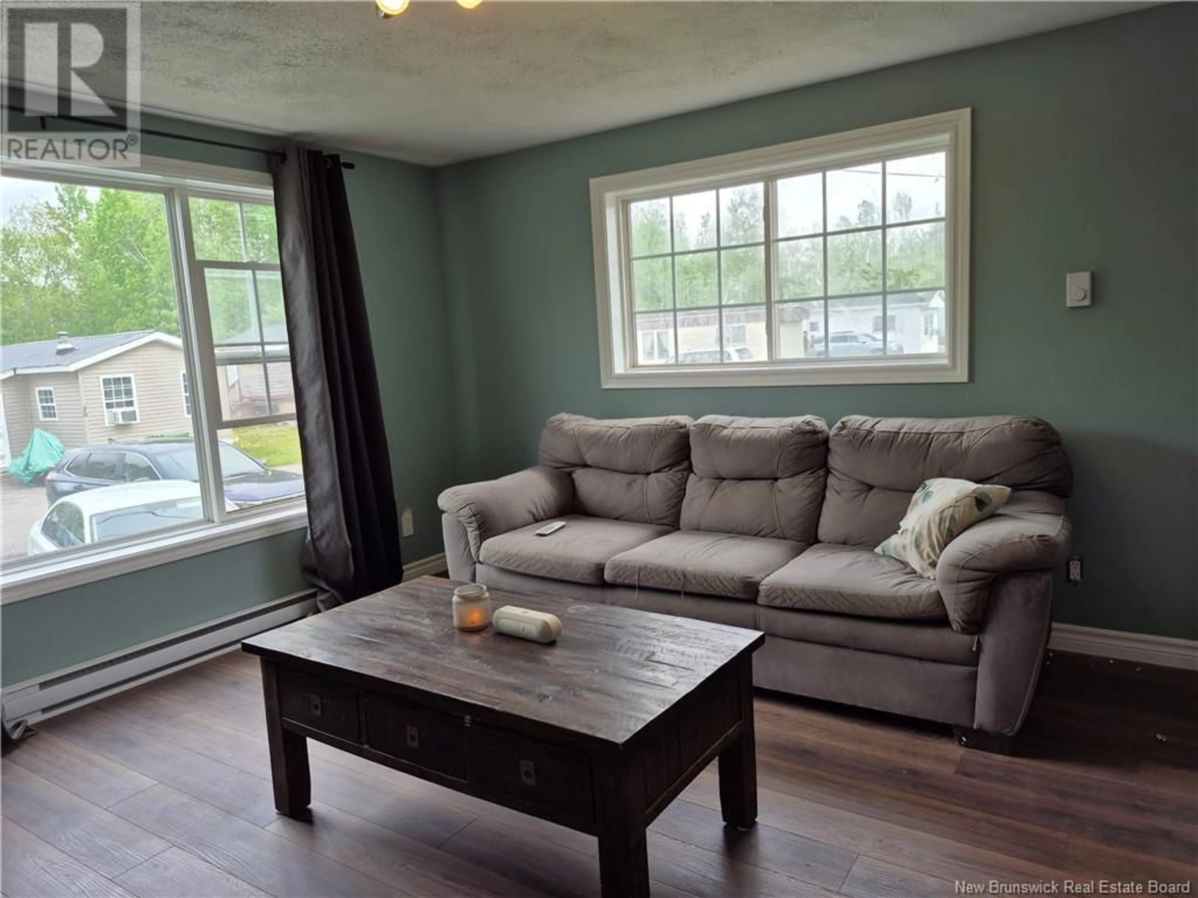 Living room with furniture, wood/laminate floor for 27 RYAN DRIVE, Kingsley New Brunswick E3G6G7