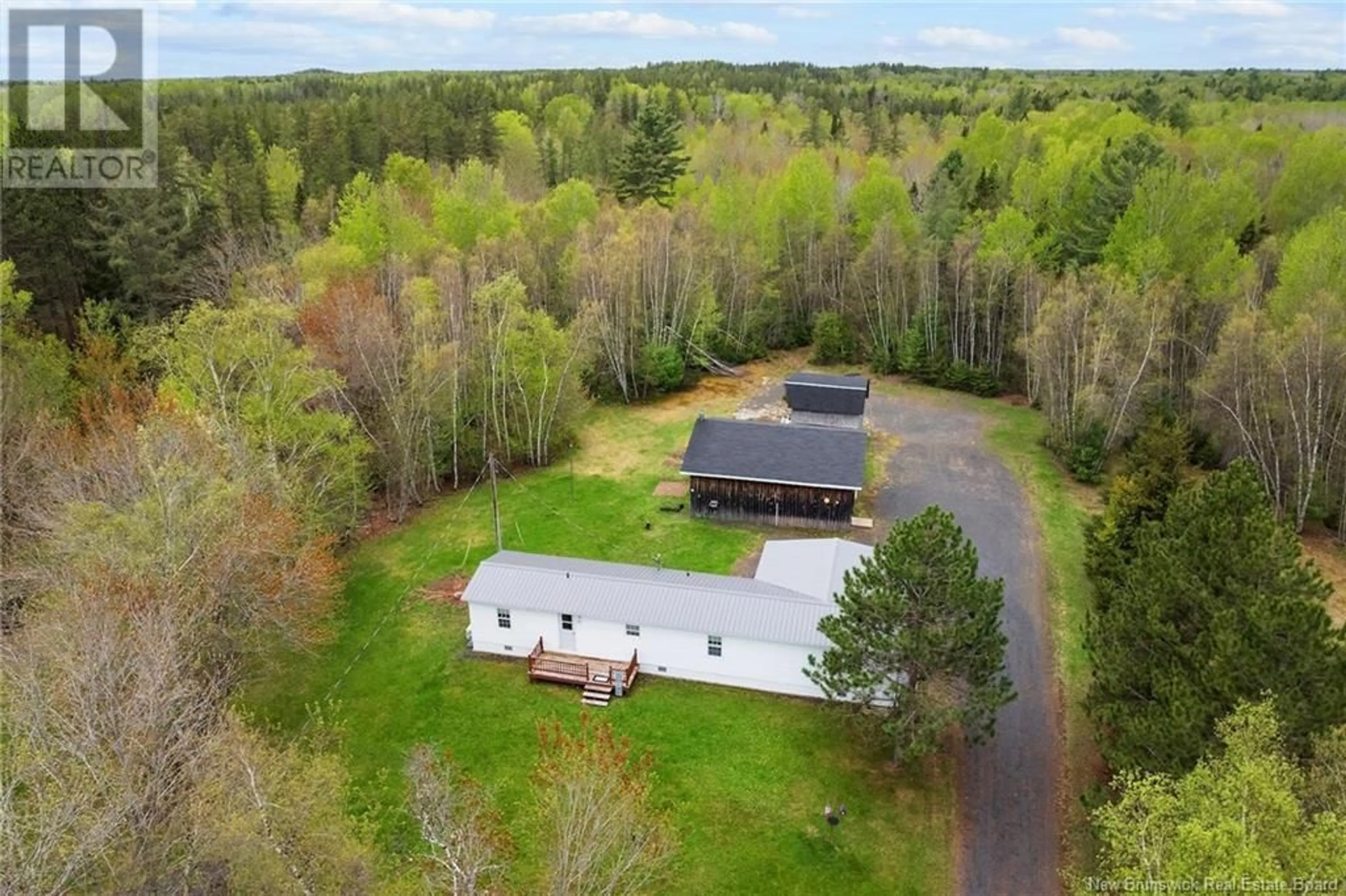 A pic from outside/outdoor area/front of a property/back of a property/a pic from drone, forest/trees view for 202 UPTON STREET, Minto New Brunswick E4B3V9