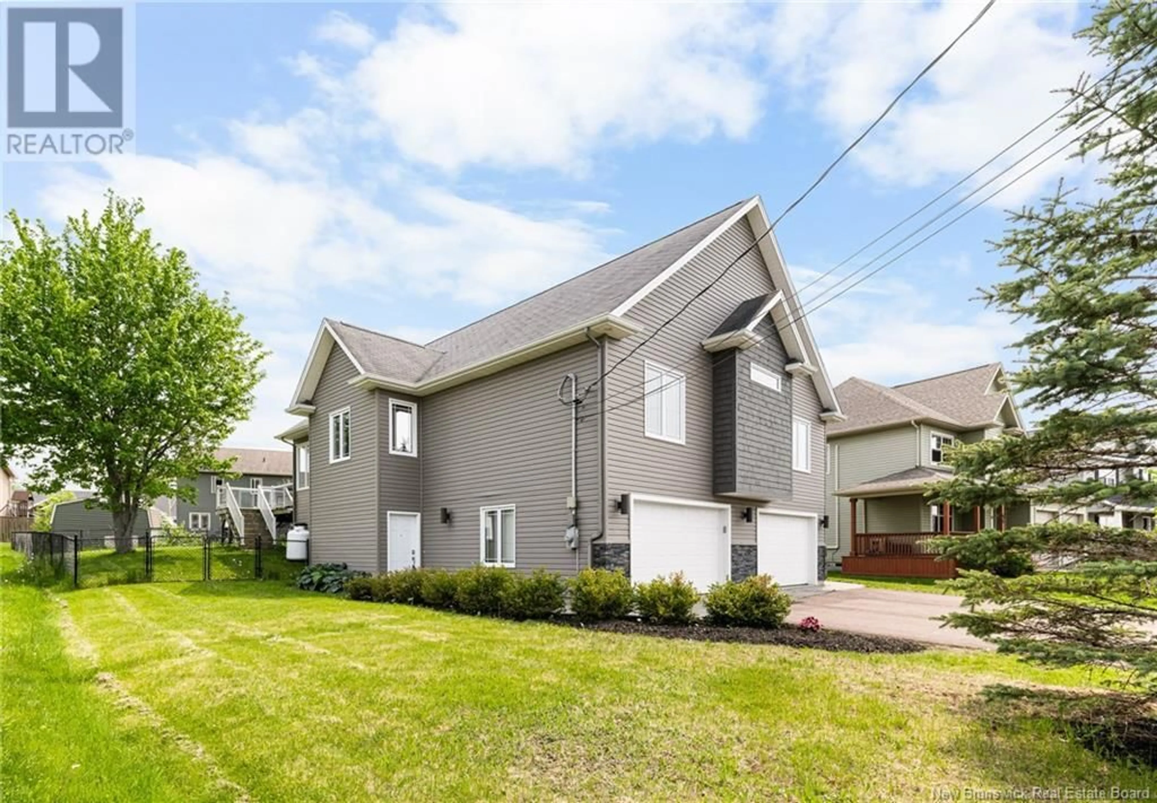Home with vinyl exterior material, street for 65 DES AUBES, Dieppe New Brunswick E1A5S2