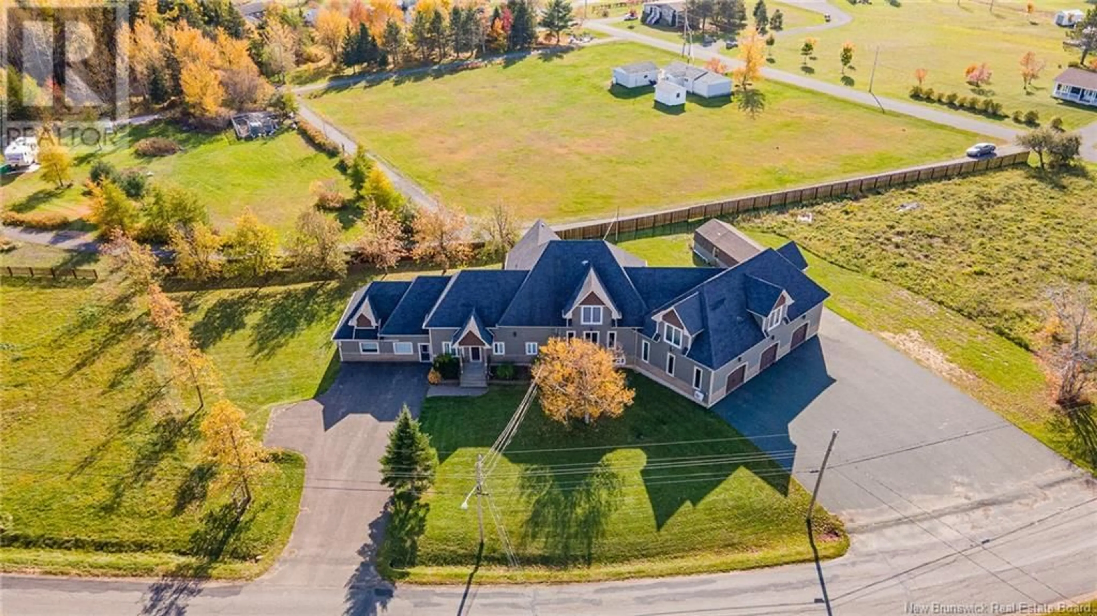 A pic from outside/outdoor area/front of a property/back of a property/a pic from drone, unknown for 348 DIGNARD STREET, Tracadie New Brunswick E1X1A2