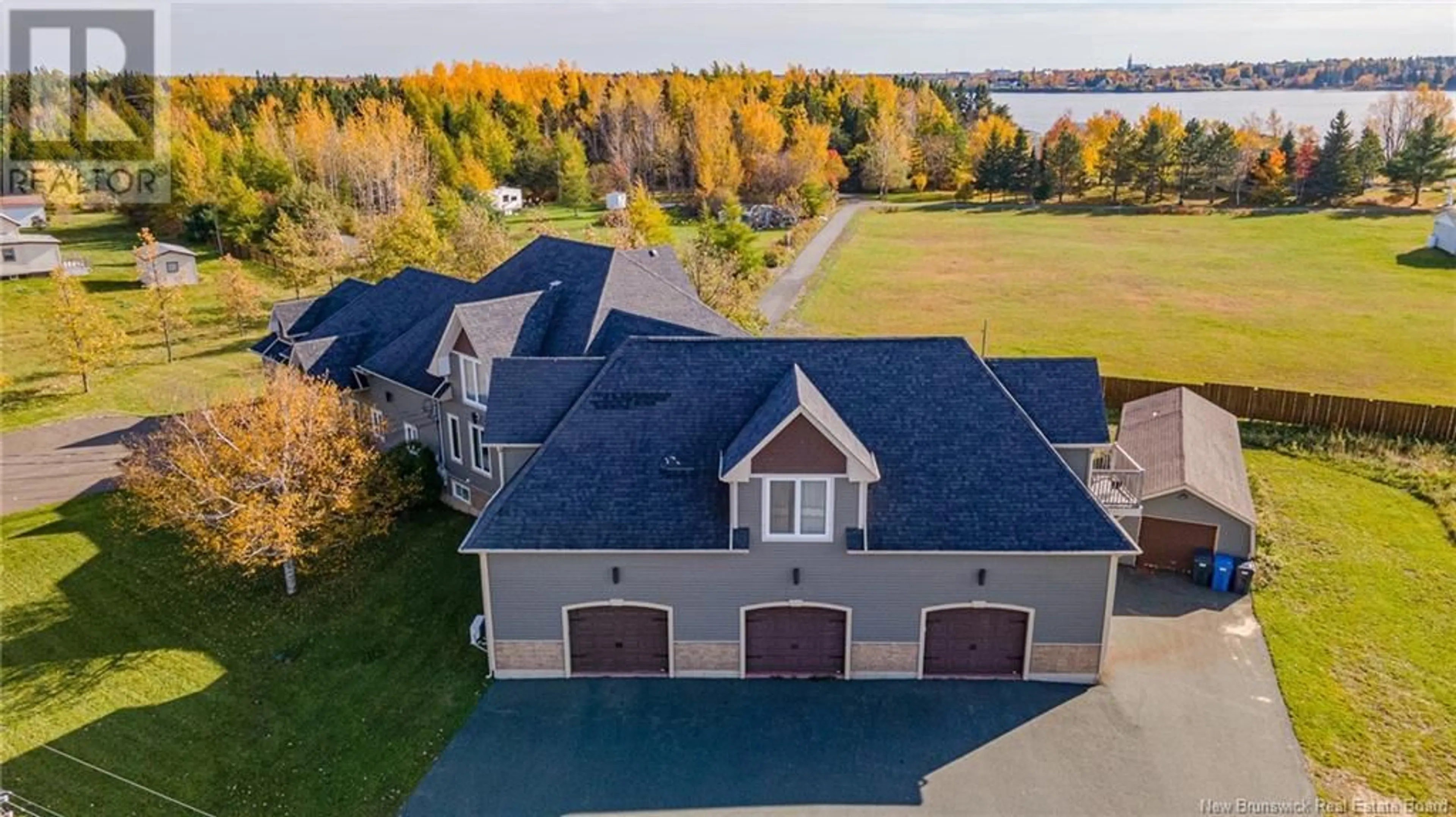 A pic from outside/outdoor area/front of a property/back of a property/a pic from drone, water/lake/river/ocean view for 348 DIGNARD STREET, Tracadie New Brunswick E1X1A2