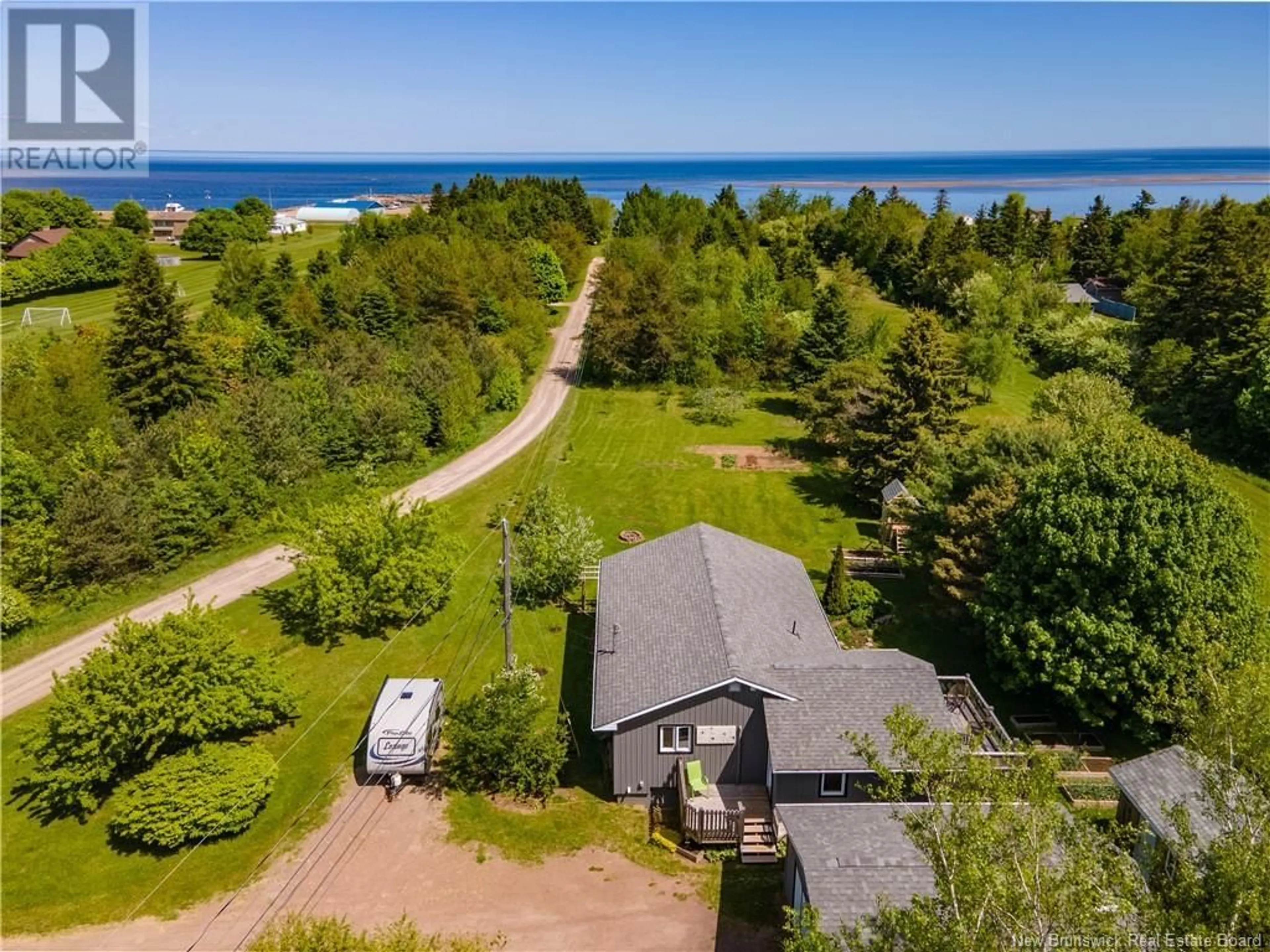 A pic from outside/outdoor area/front of a property/back of a property/a pic from drone, water/lake/river/ocean view for 19 DES LAURIERS, Grand-Barachois New Brunswick E4P7G8