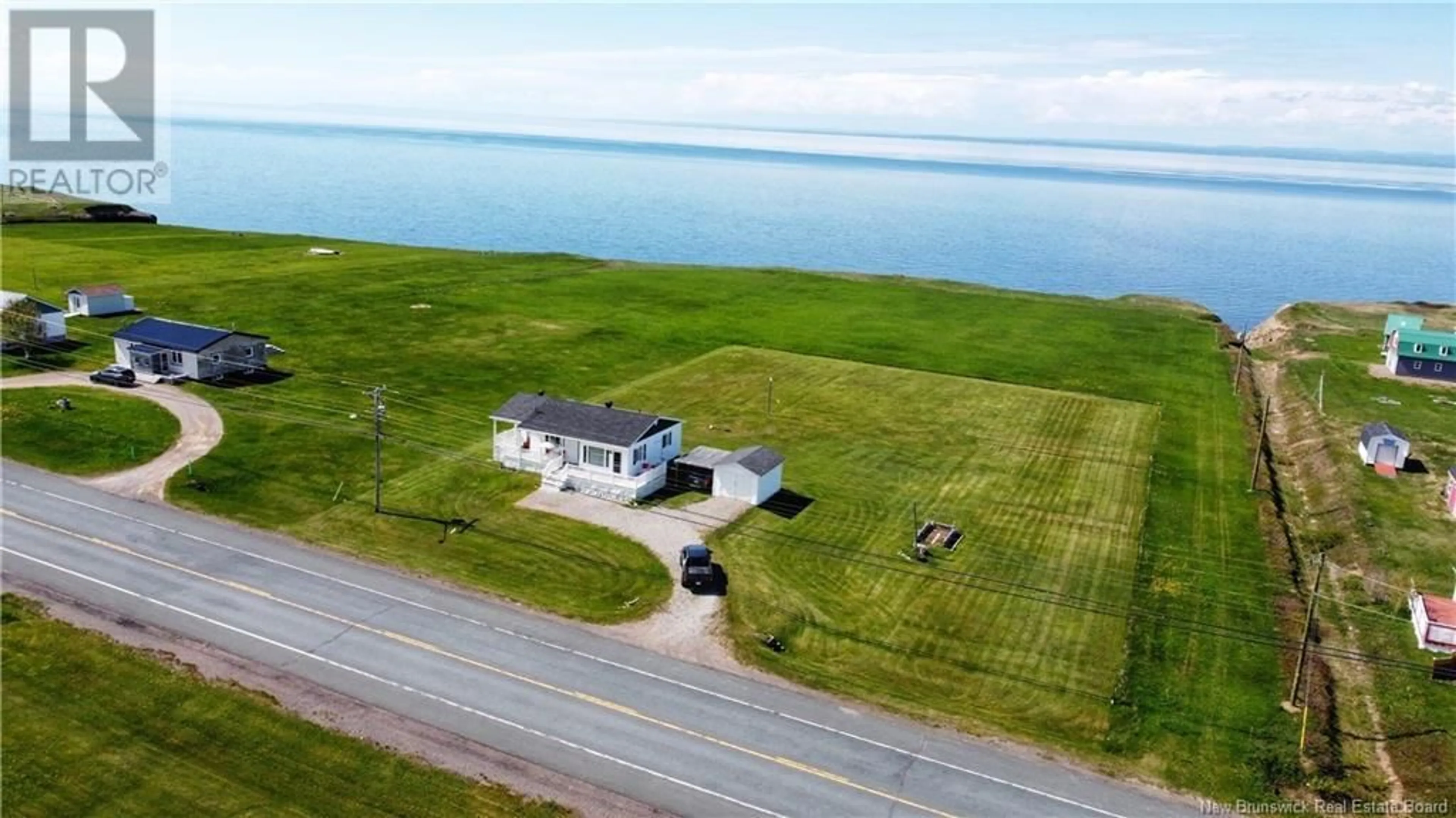 A pic from outside/outdoor area/front of a property/back of a property/a pic from drone, water/lake/river/ocean view for 506 RUE ACADIE, Grande-Anse New Brunswick E8N1E4