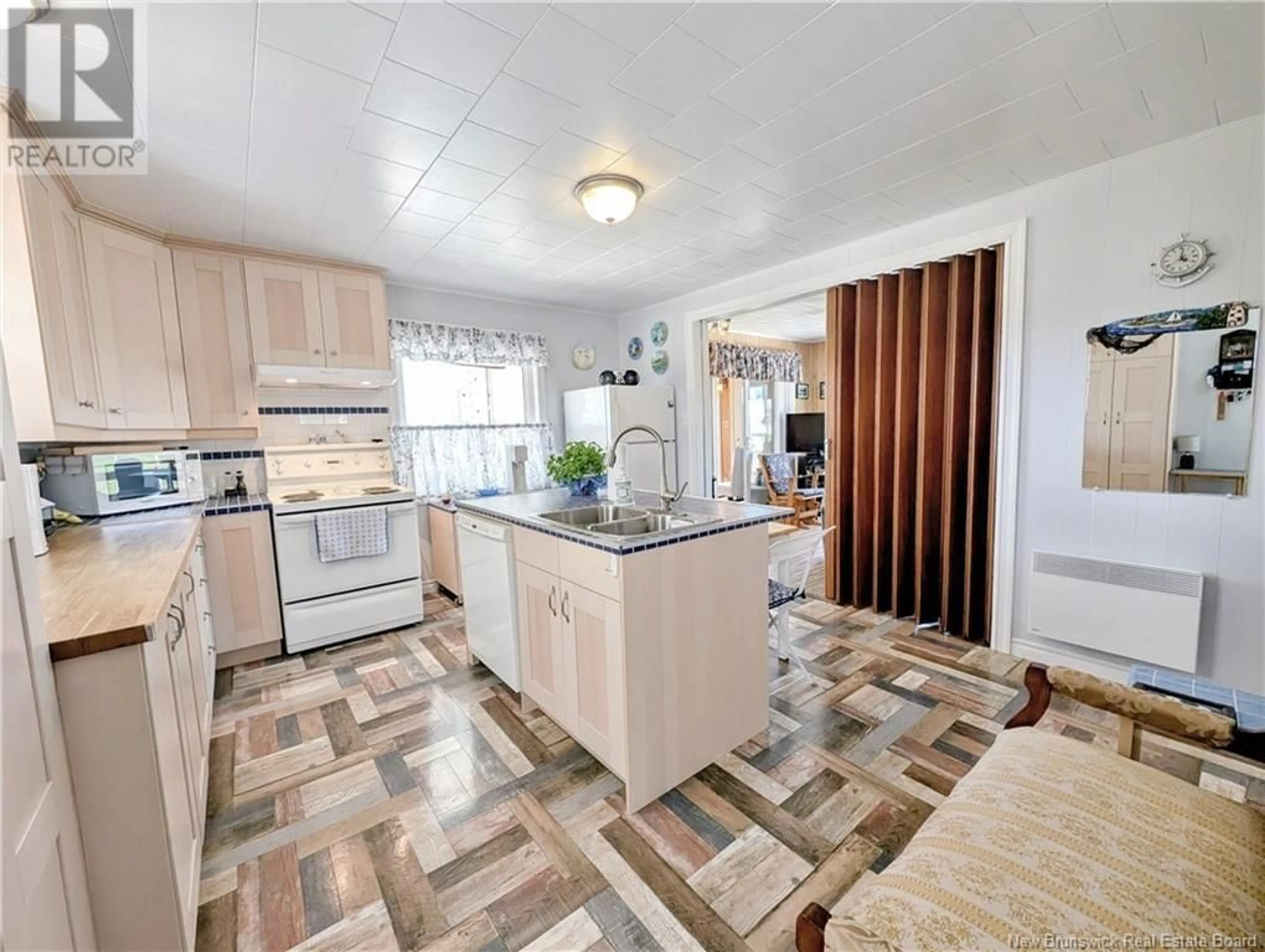 Open concept kitchen, ceramic/tile floor for 506 RUE ACADIE, Grande-Anse New Brunswick E8N1E4