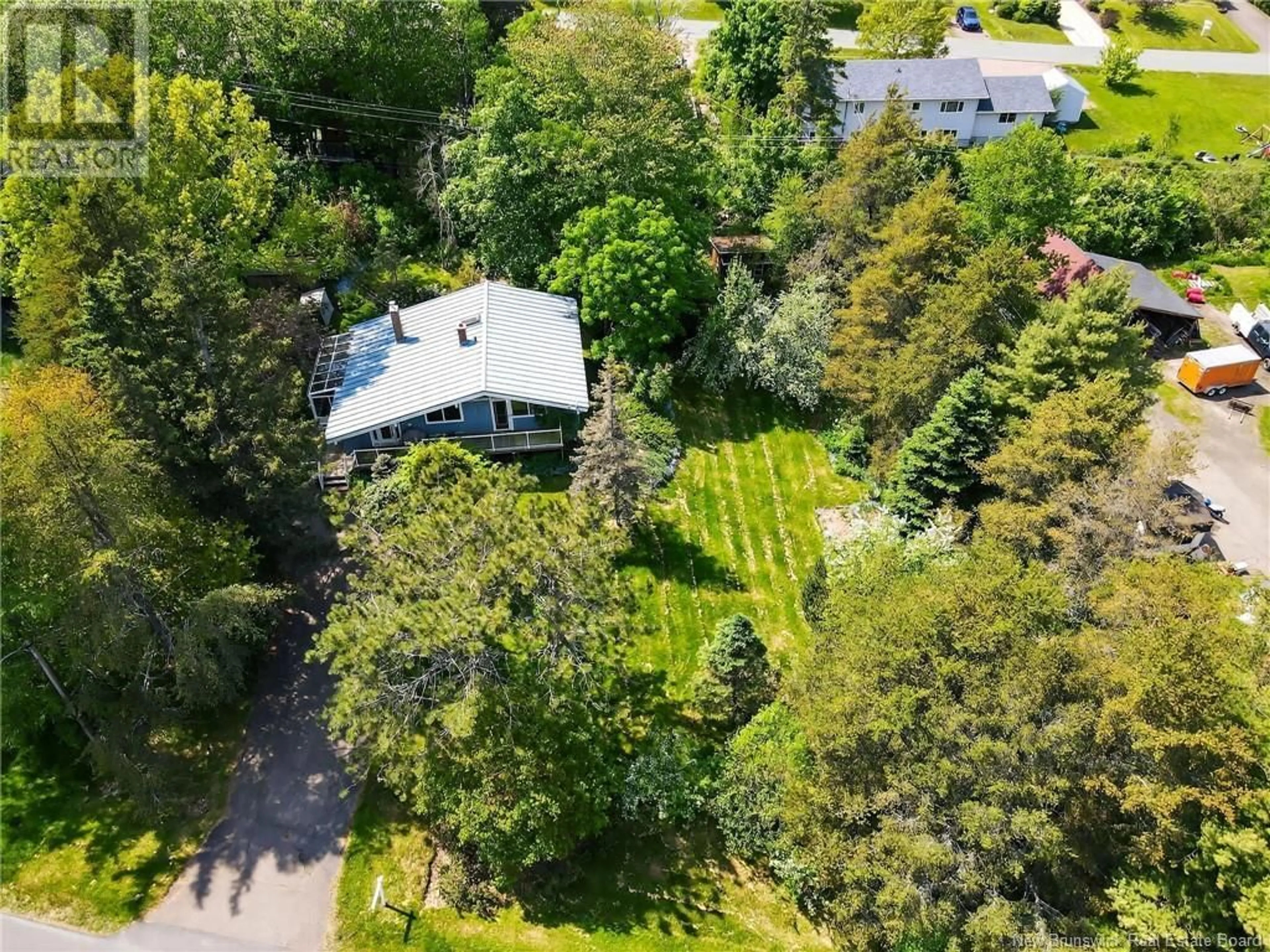A pic from outside/outdoor area/front of a property/back of a property/a pic from drone, forest/trees view for 15 MAPLE, Sackville New Brunswick E4L4C5
