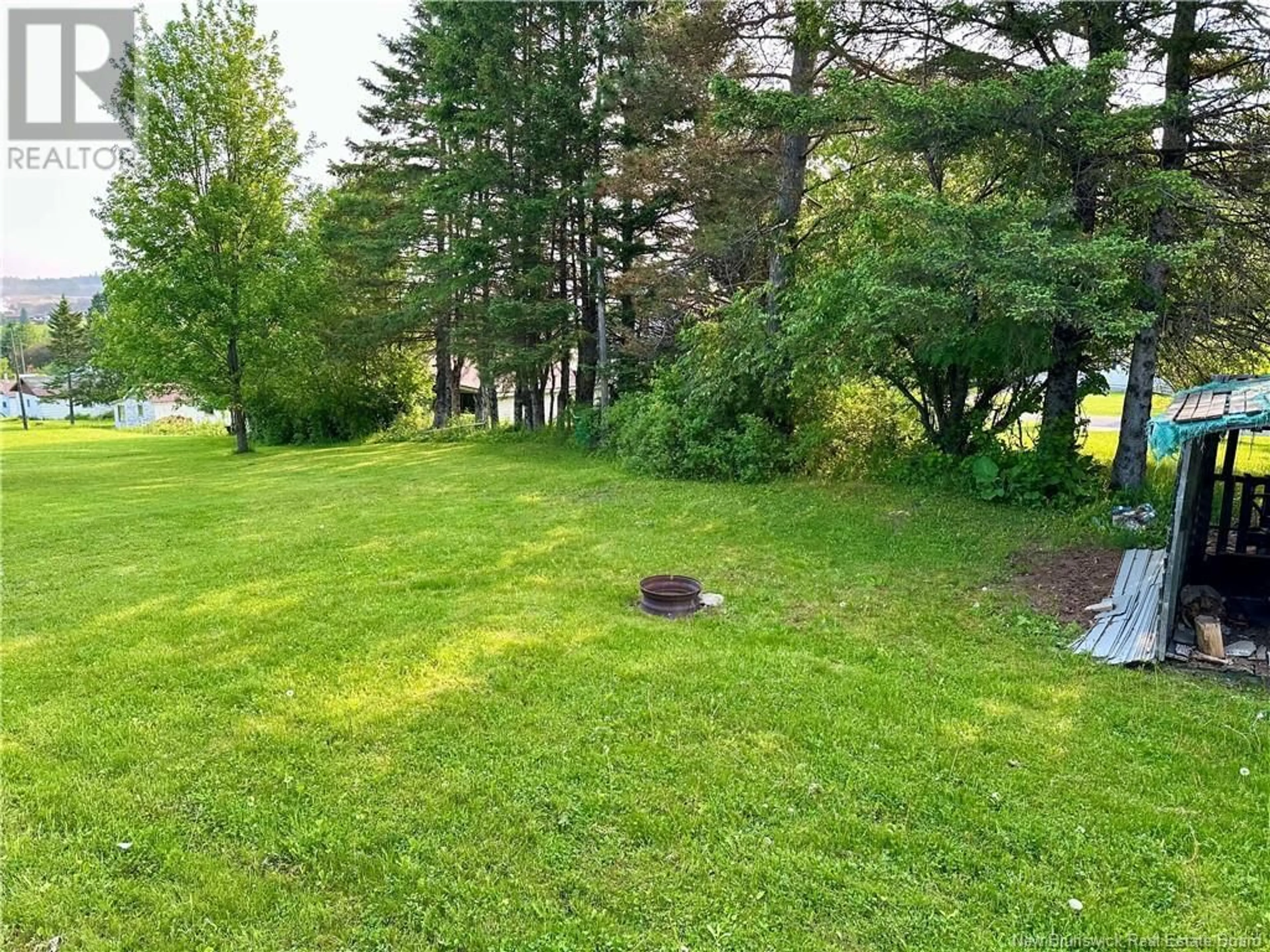 A pic from outside/outdoor area/front of a property/back of a property/a pic from drone, forest/trees view for 142 MAIN STREET, Plaster Rock New Brunswick E7G2E4
