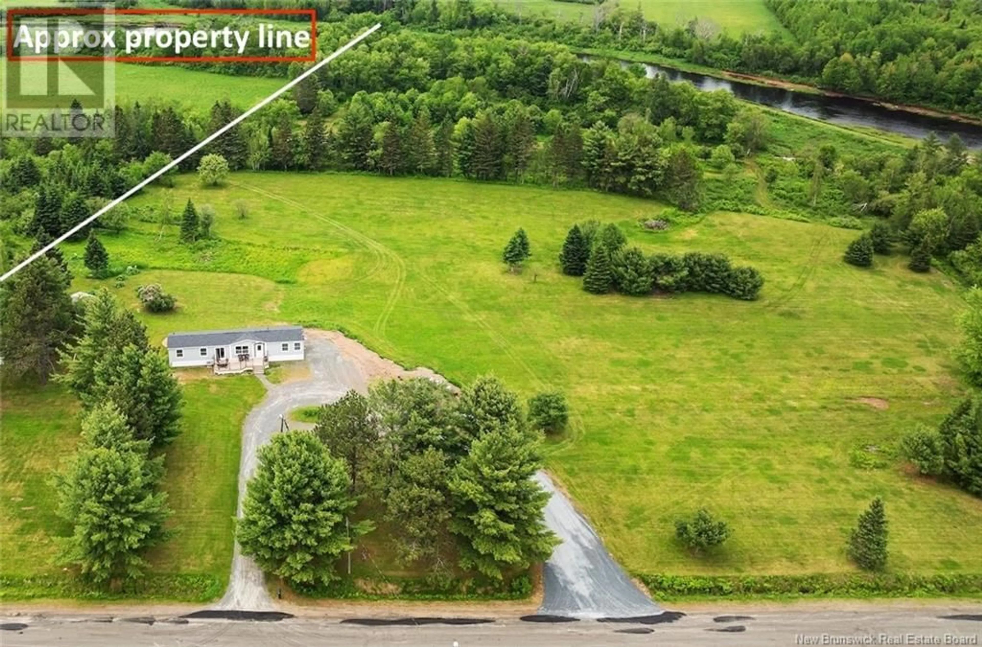 A pic from outside/outdoor area/front of a property/back of a property/a pic from drone, forest/trees view for 184 RIVERSIDE DRIVE, Fredericton Junction New Brunswick E5L1V9