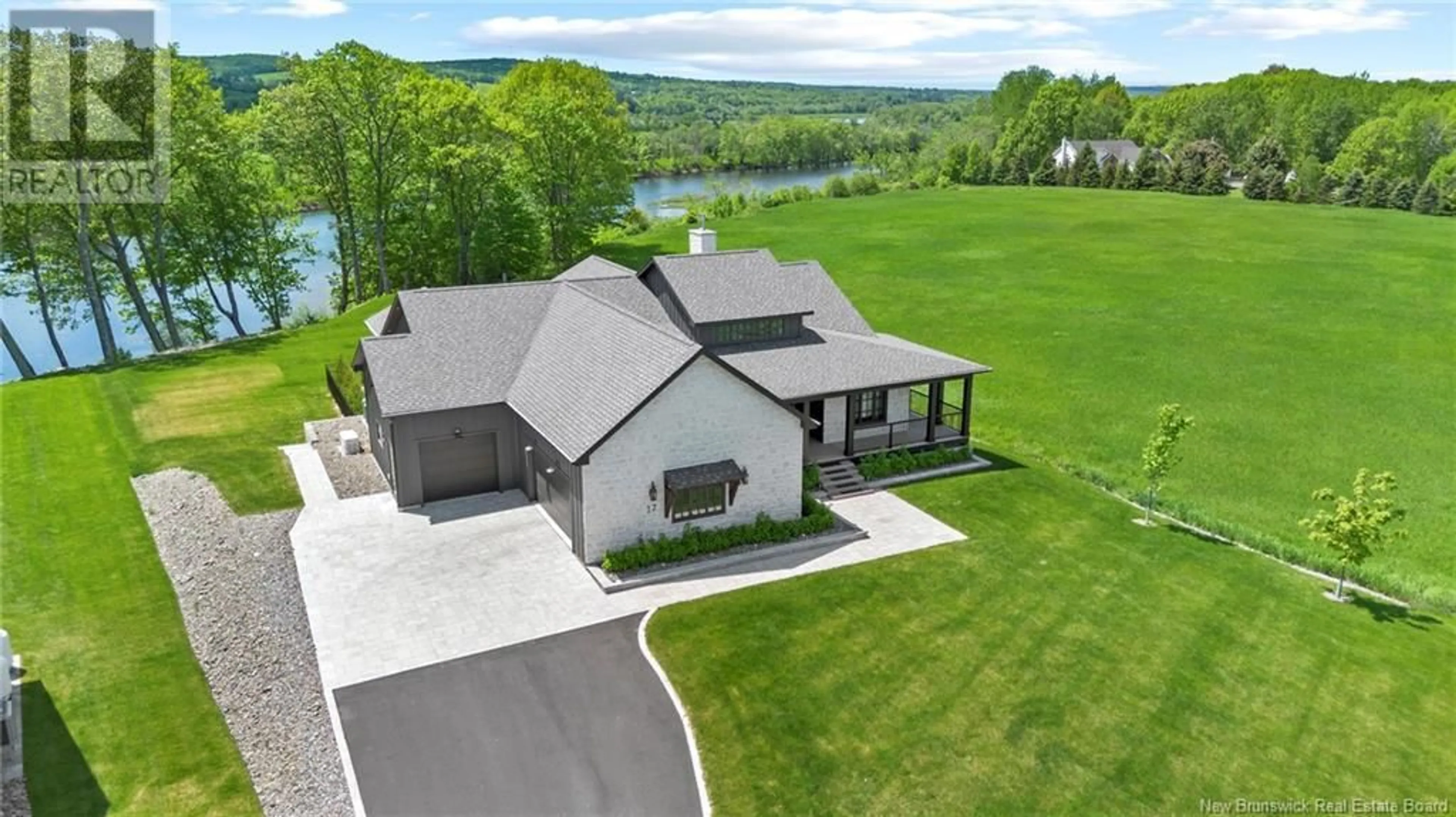 A pic from outside/outdoor area/front of a property/back of a property/a pic from drone, water/lake/river/ocean view for 17 BLAKE COURT, Fredericton New Brunswick E3G7K9