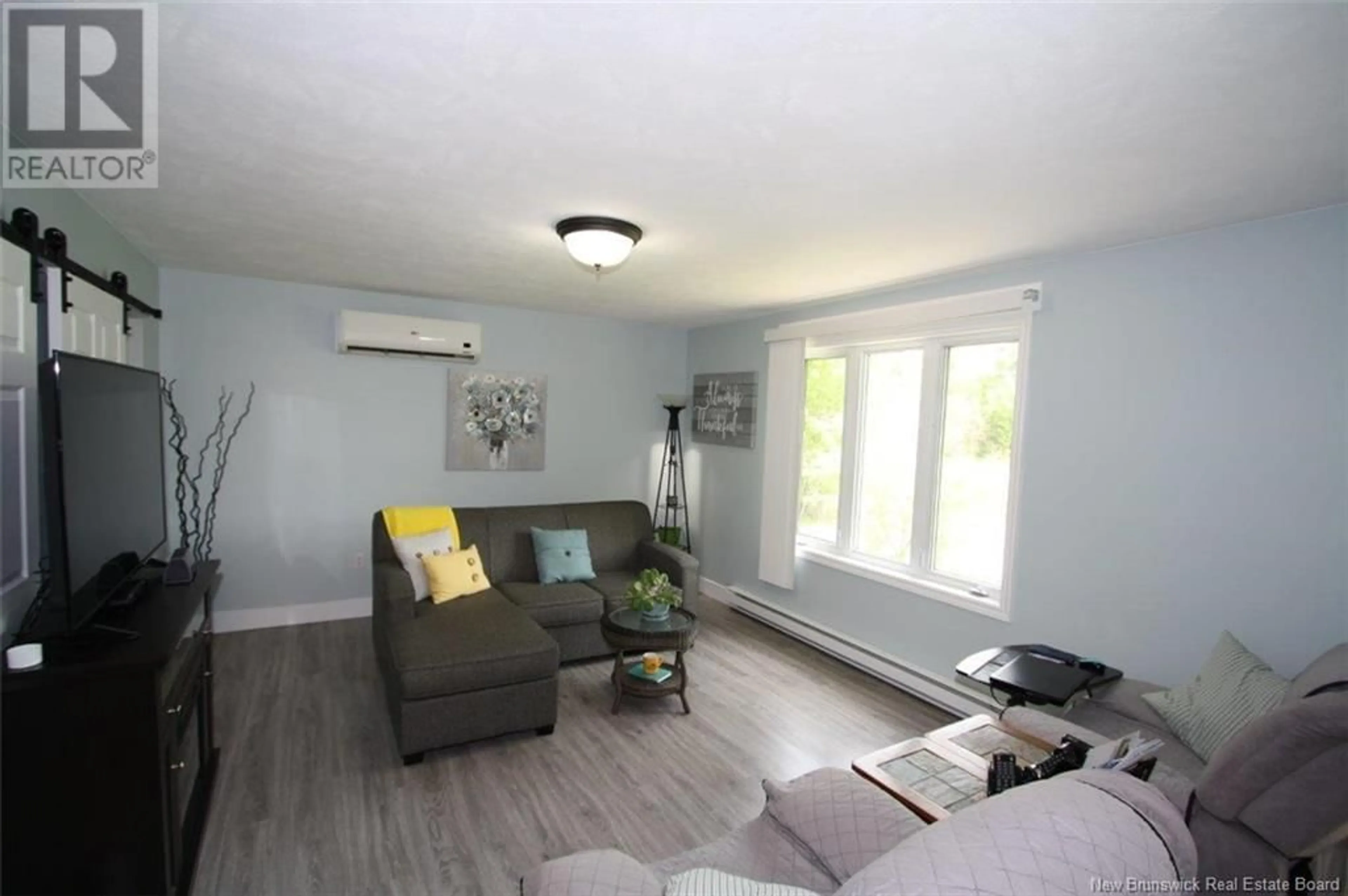 Living room with furniture, wood/laminate floor for 165 ROUTE 148, Killarney Road New Brunswick E3G9G2