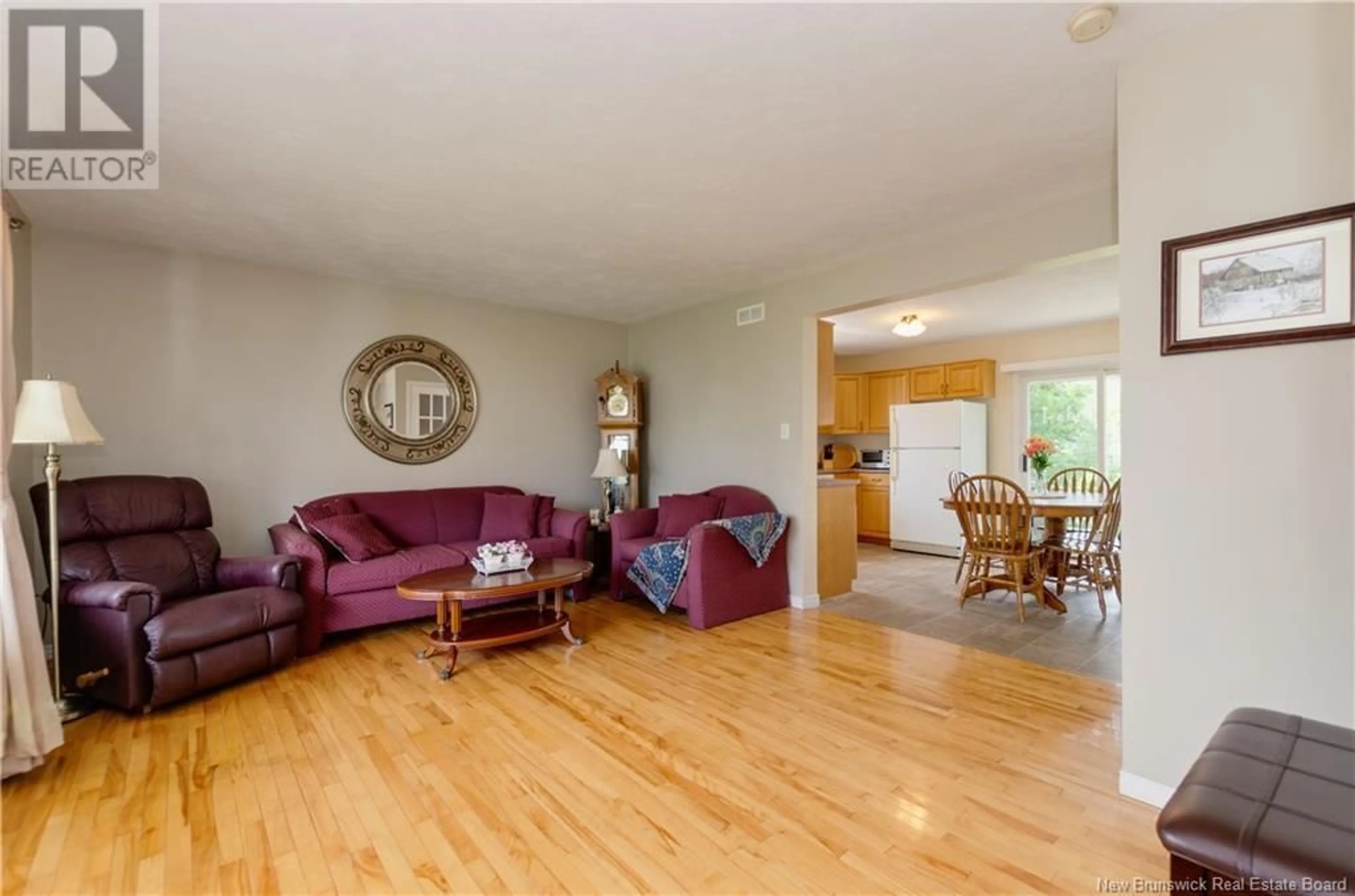 Living room with furniture, wood/laminate floor for 38 RENNICK ROAD, Moncton New Brunswick E1G4T9