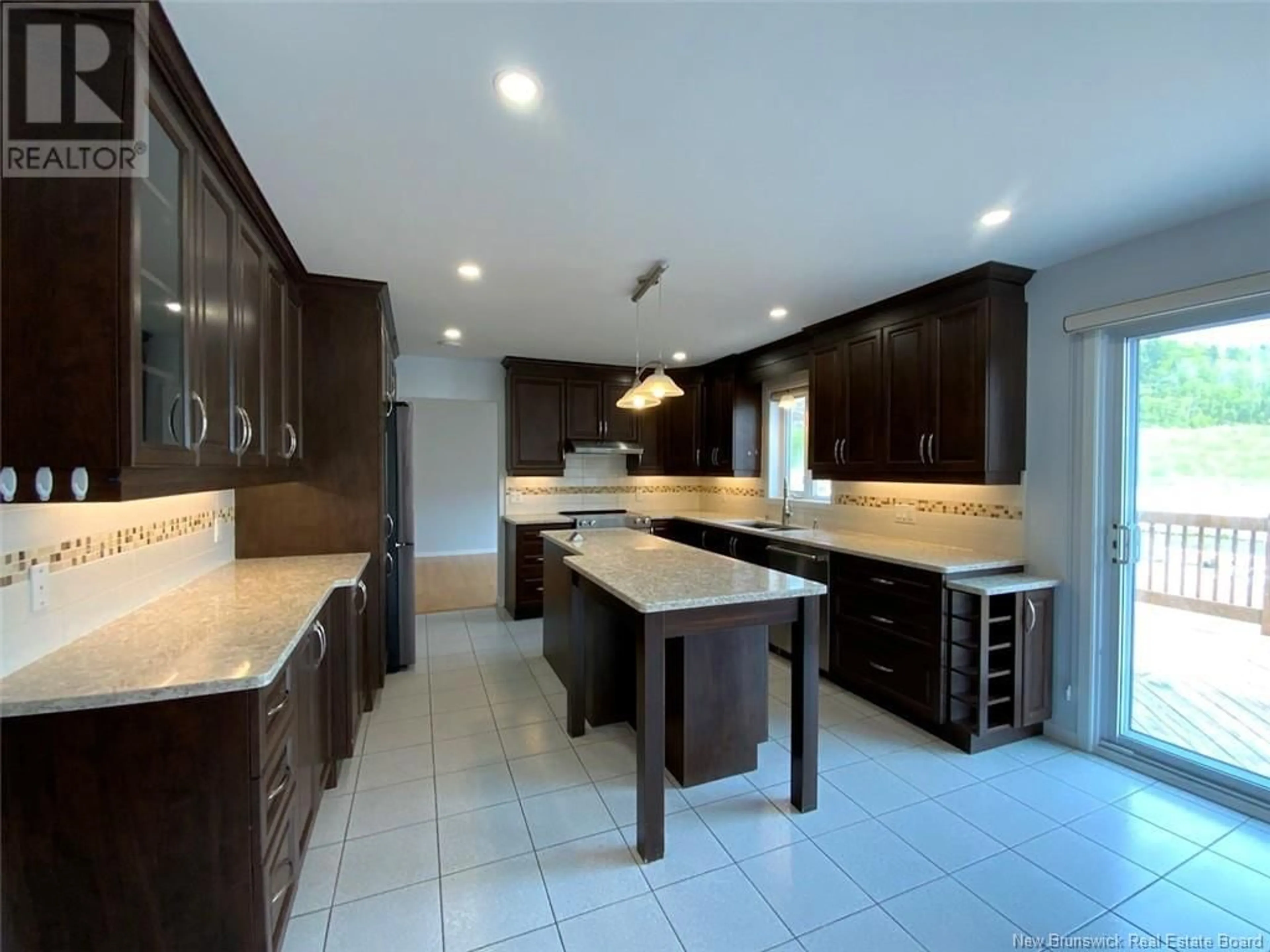 Open concept kitchen, ceramic/tile floor for 33 THIBAUDEAU AVENUE, Edmundston New Brunswick E3V4Z1