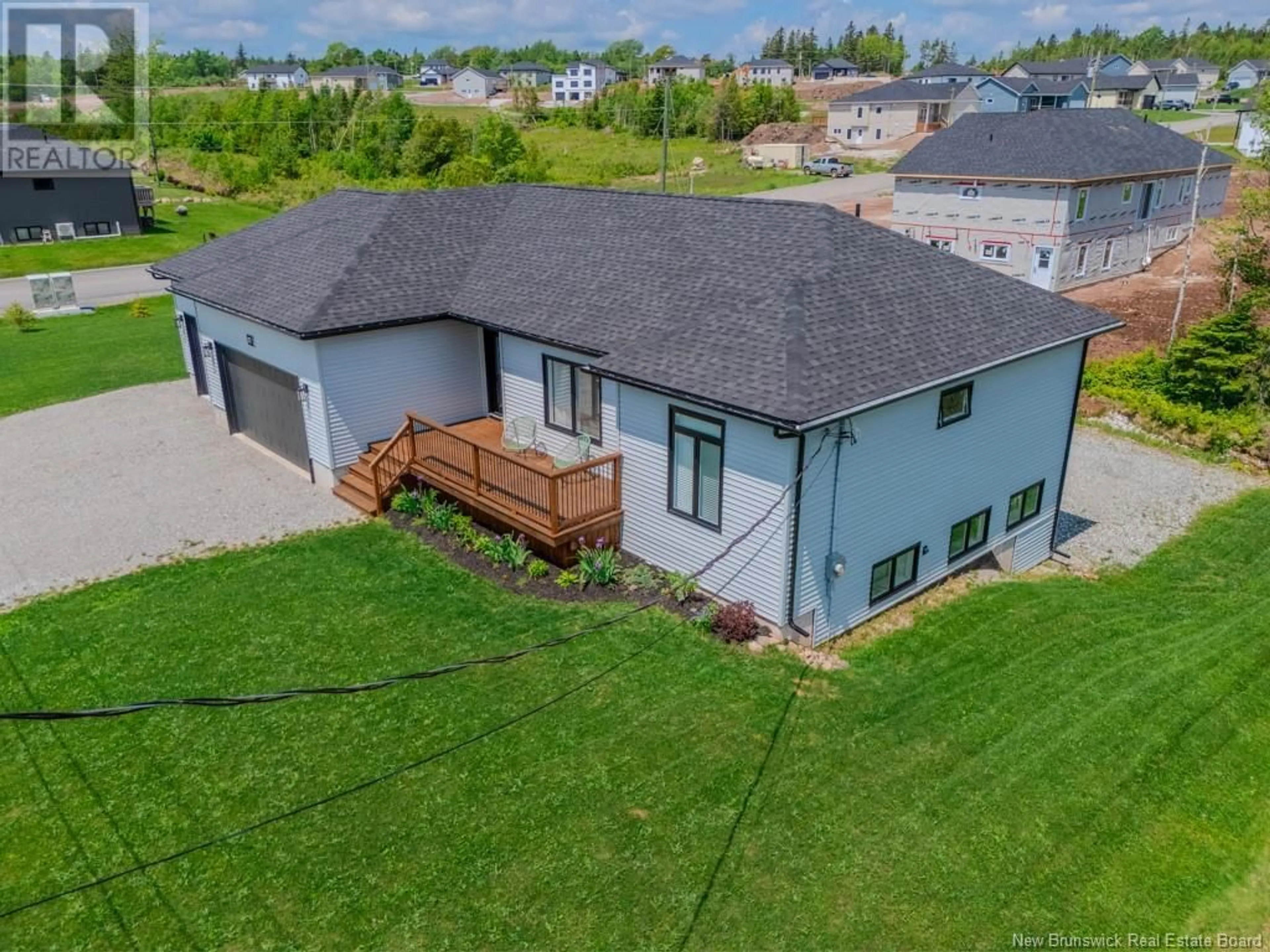 A pic from outside/outdoor area/front of a property/back of a property/a pic from drone, unknown for 77 MEADOWLARK DRIVE, Quispamsis New Brunswick E2E0T6