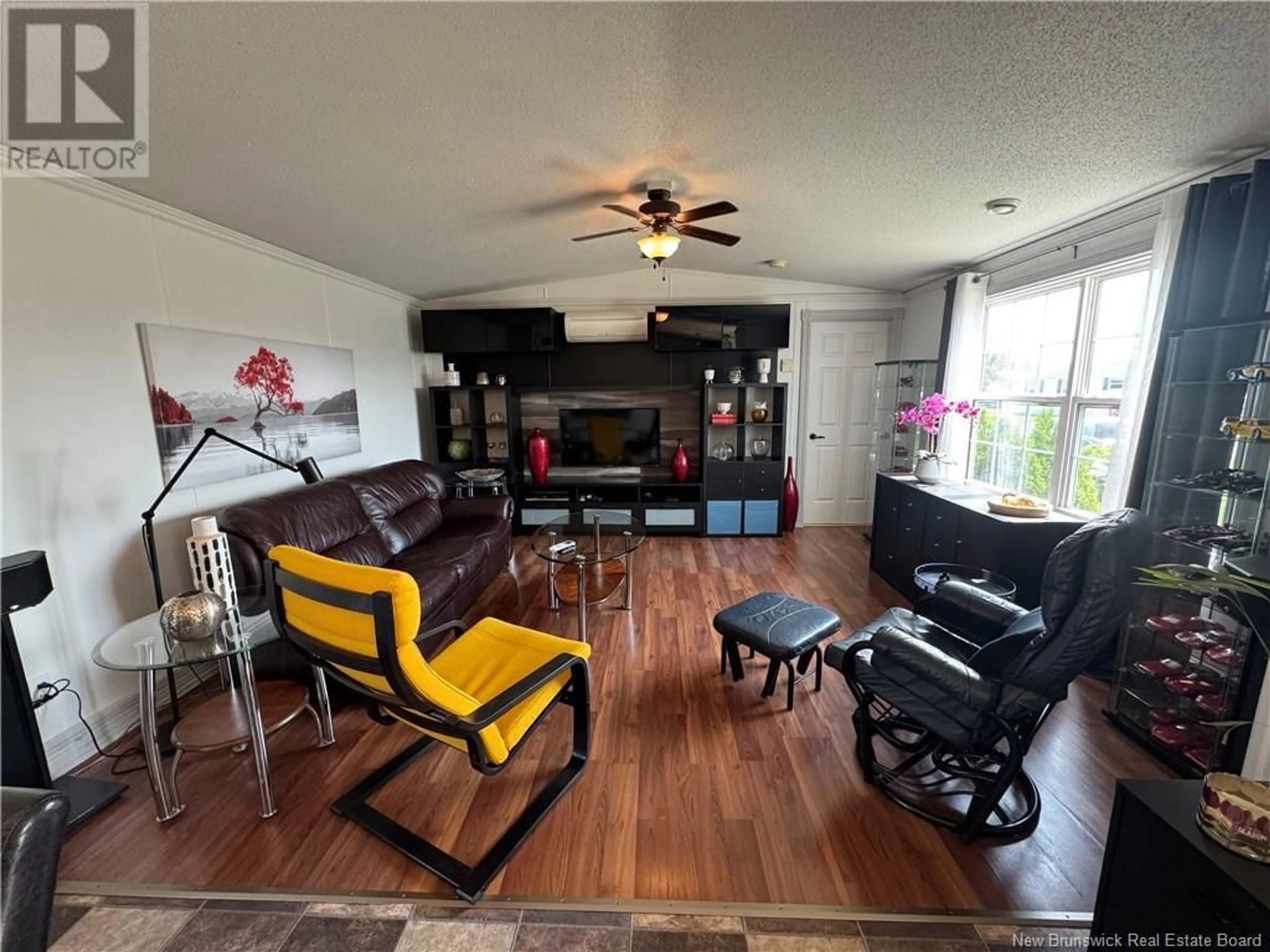 Living room with furniture, wood/laminate floor for 17 LOBELIA STREET, Moncton New Brunswick E1H2Y6