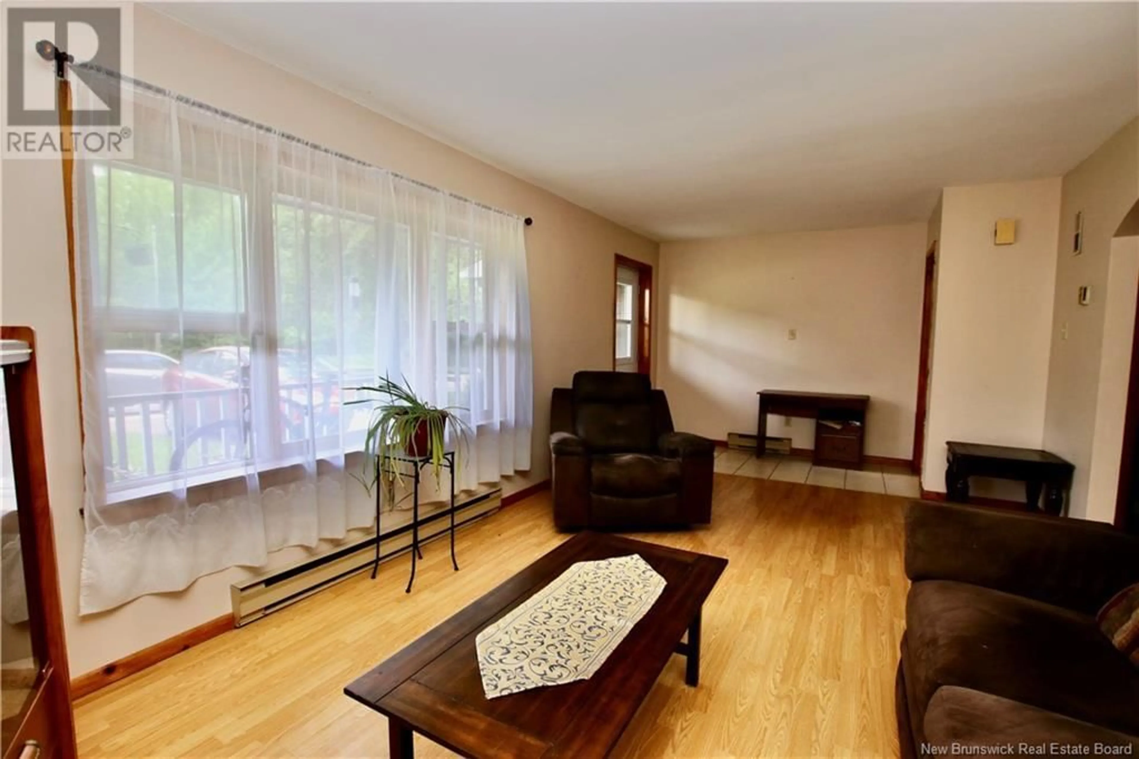 Living room with furniture, wood/laminate floor for 11 WATERFALL DRIVE, Riverview New Brunswick E1B4M1