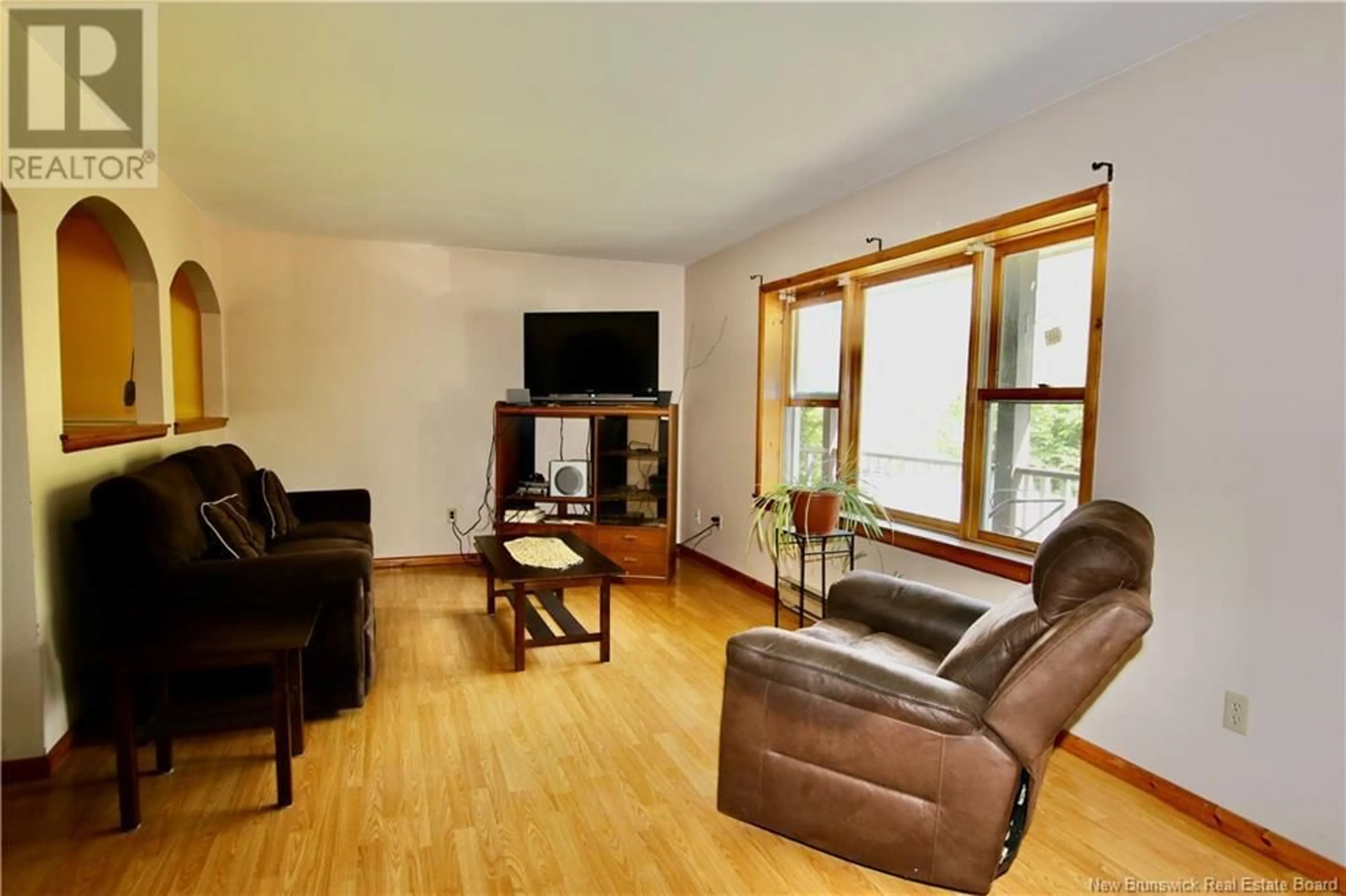 Living room with furniture, wood/laminate floor for 11 WATERFALL DRIVE, Riverview New Brunswick E1B4M1