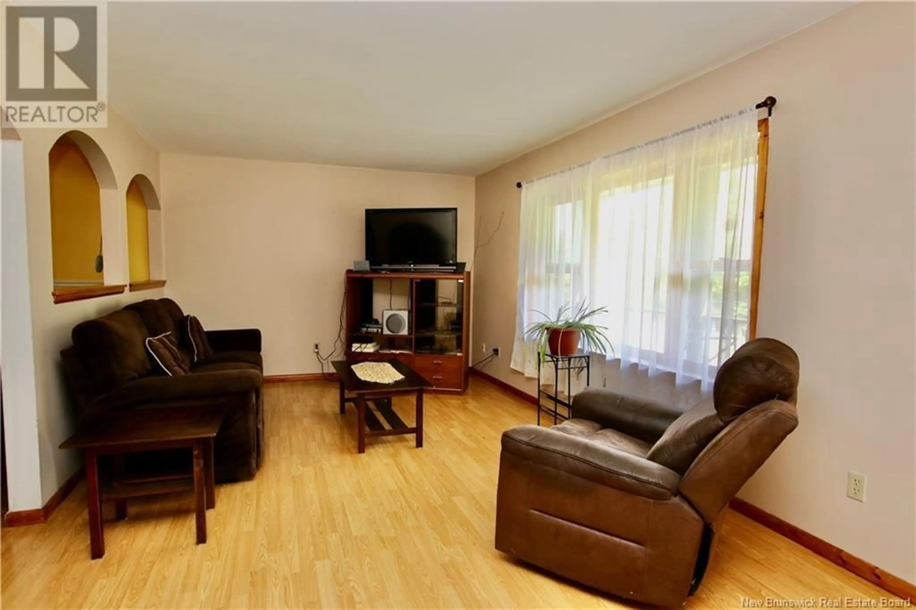 Living room with furniture, wood/laminate floor for 11 WATERFALL DRIVE, Riverview New Brunswick E1B4M1