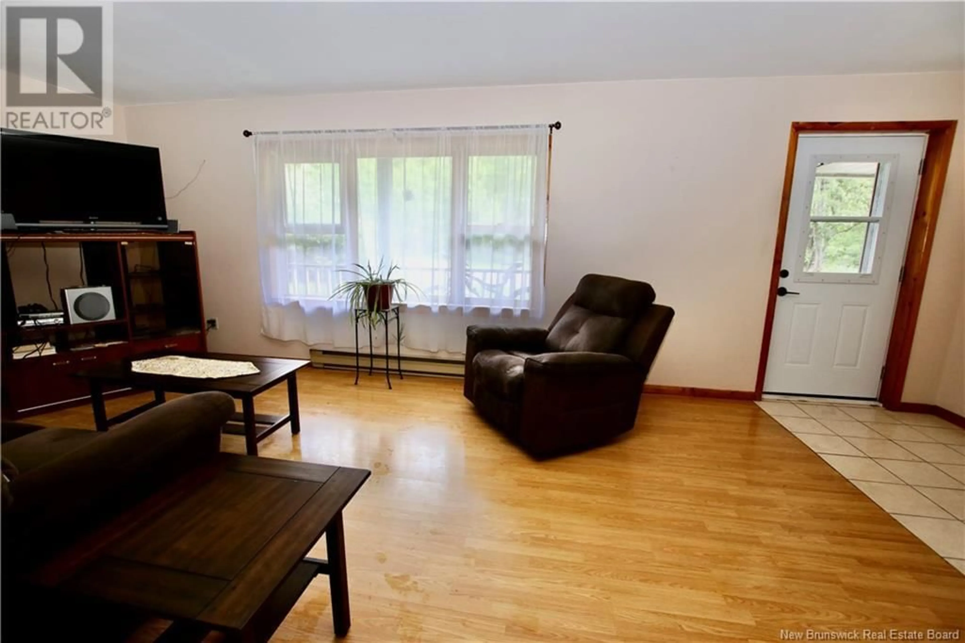 Living room with furniture, wood/laminate floor for 11 WATERFALL DRIVE, Riverview New Brunswick E1B4M1