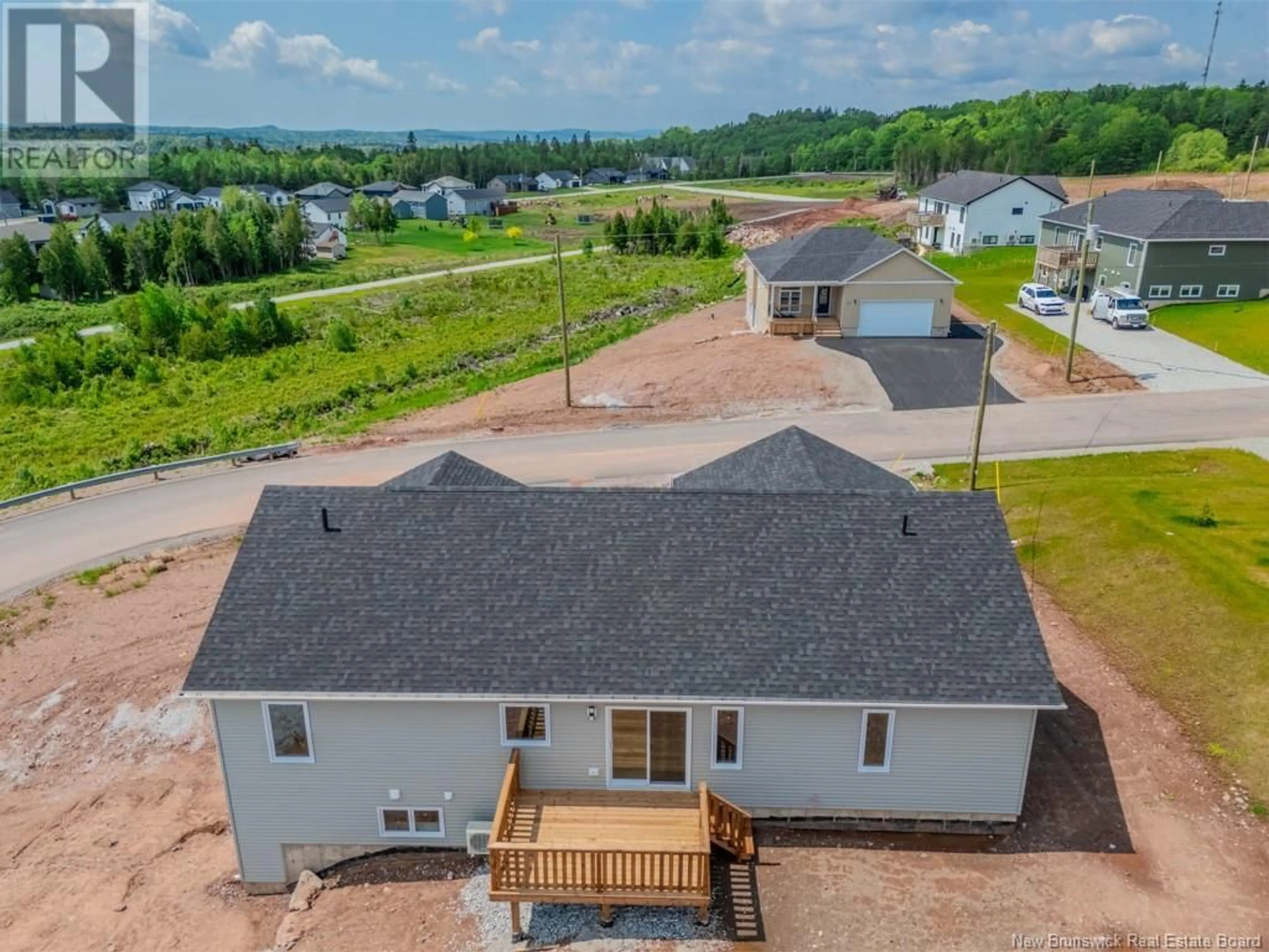 A pic from outside/outdoor area/front of a property/back of a property/a pic from drone, water/lake/river/ocean view for 22 GROSBEAK DRIVE, Quispamsis New Brunswick E2E0Y3