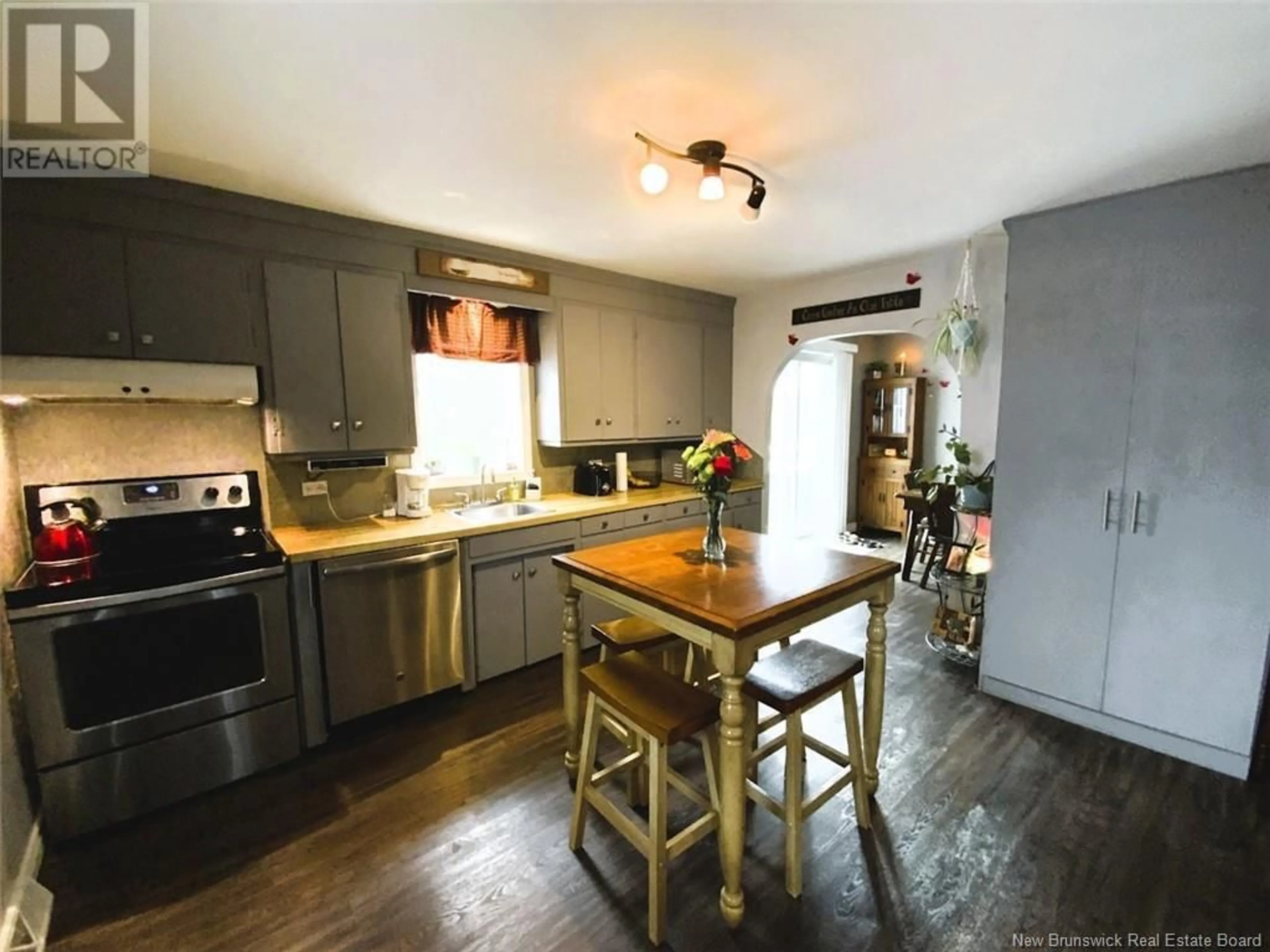 Open concept kitchen, wood/laminate floor for 122 35E AVENUE, Edmundston New Brunswick E3V2V3