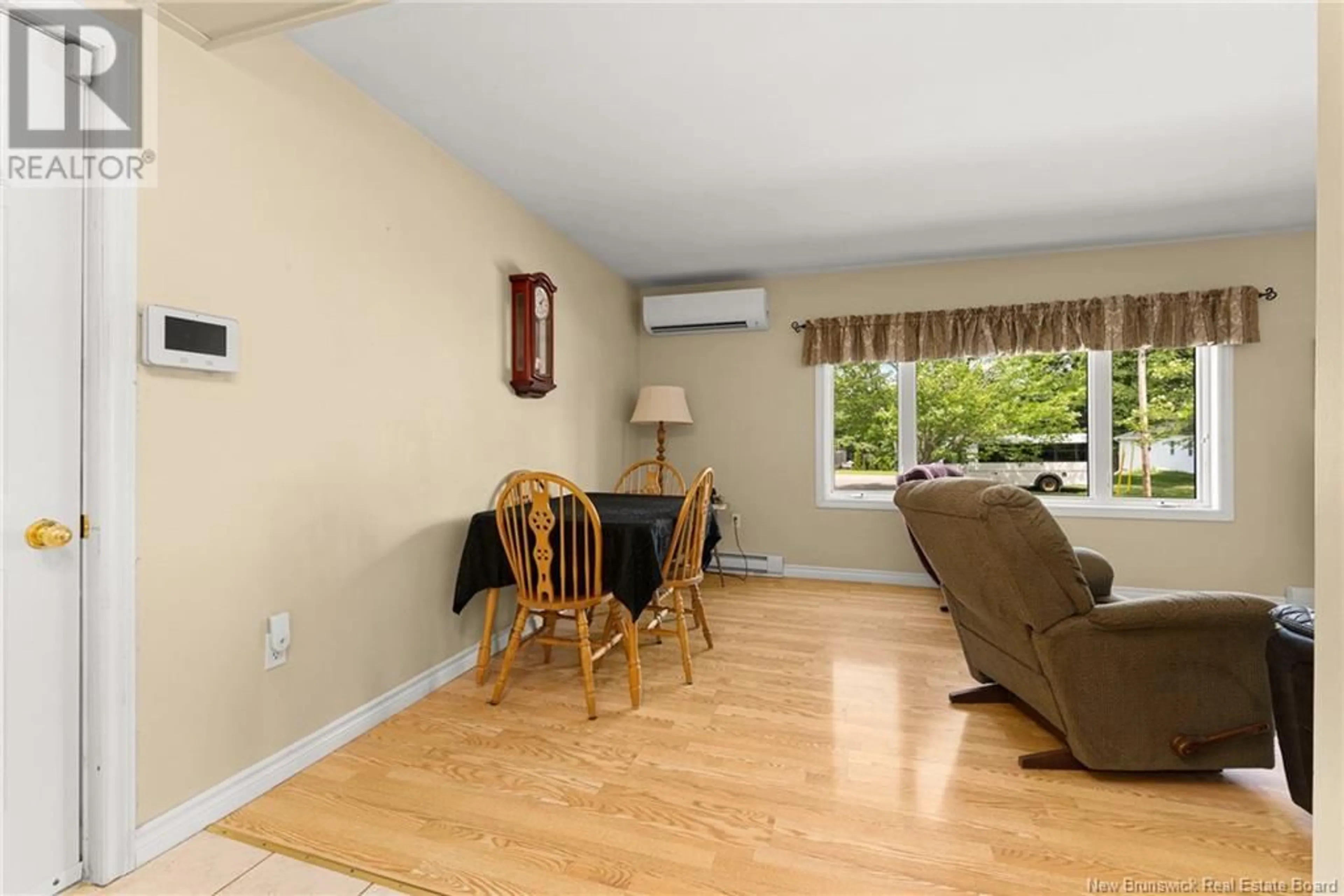 Living room with furniture, wood/laminate floor for 87 DRUMMOND STREET, Moncton New Brunswick E1A2Z3