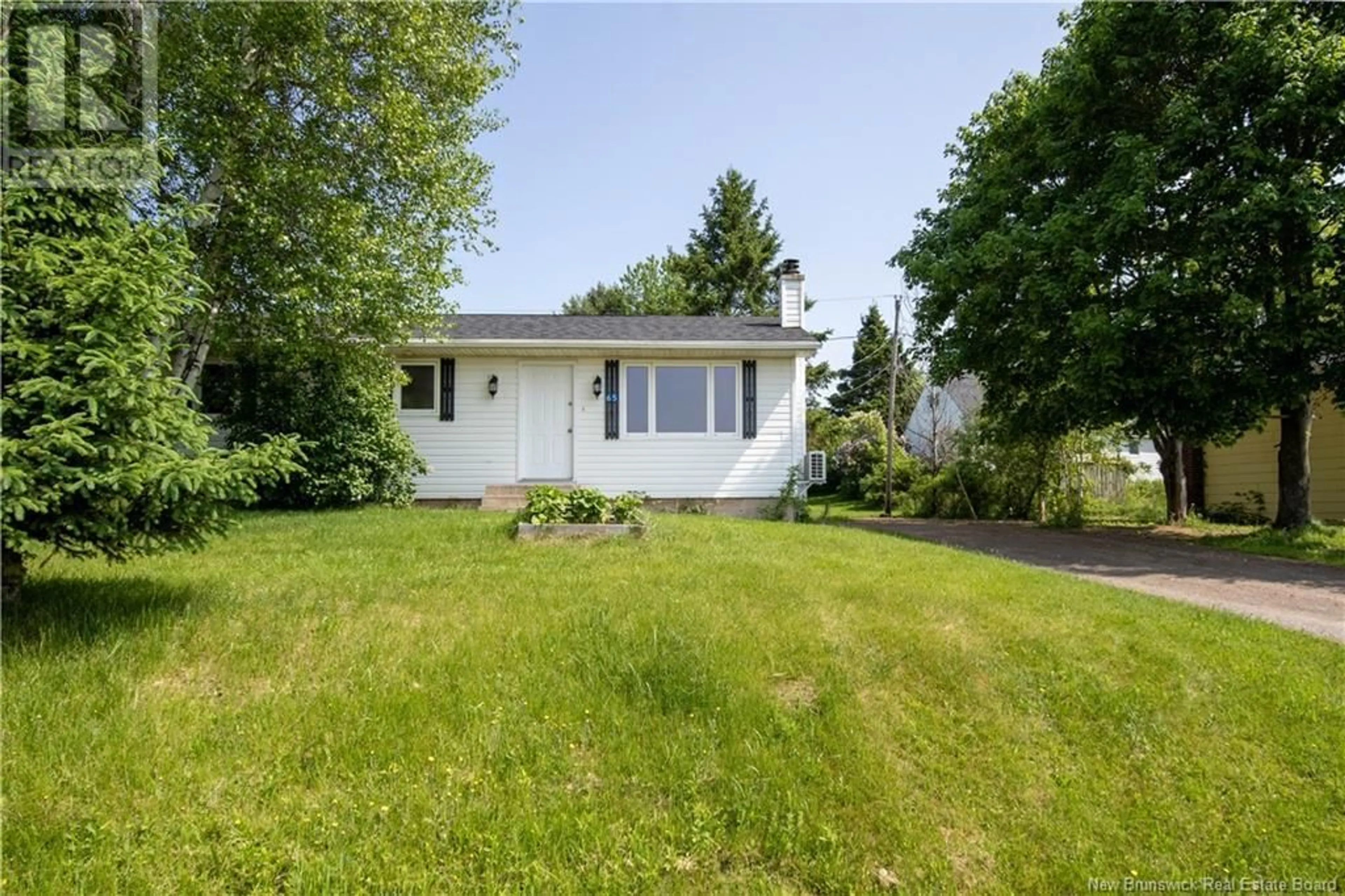 Home with vinyl exterior material, street for 65 GREEN BRIAR DRIVE, Boundary Creek New Brunswick E1G4B6