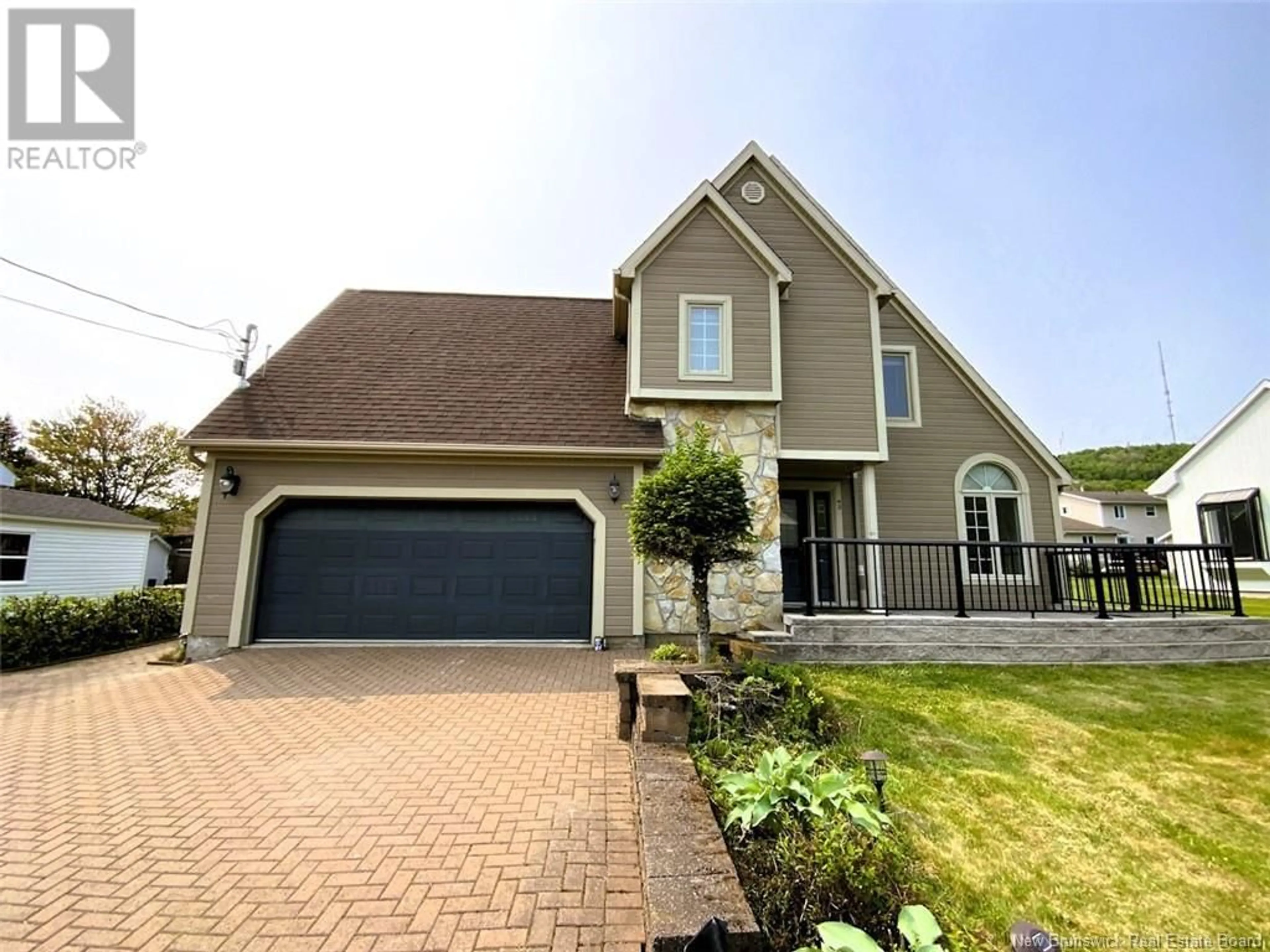 Home with vinyl exterior material, street for 42 THIBAUDEAU AVENUE, Edmundston New Brunswick E3V4Z1