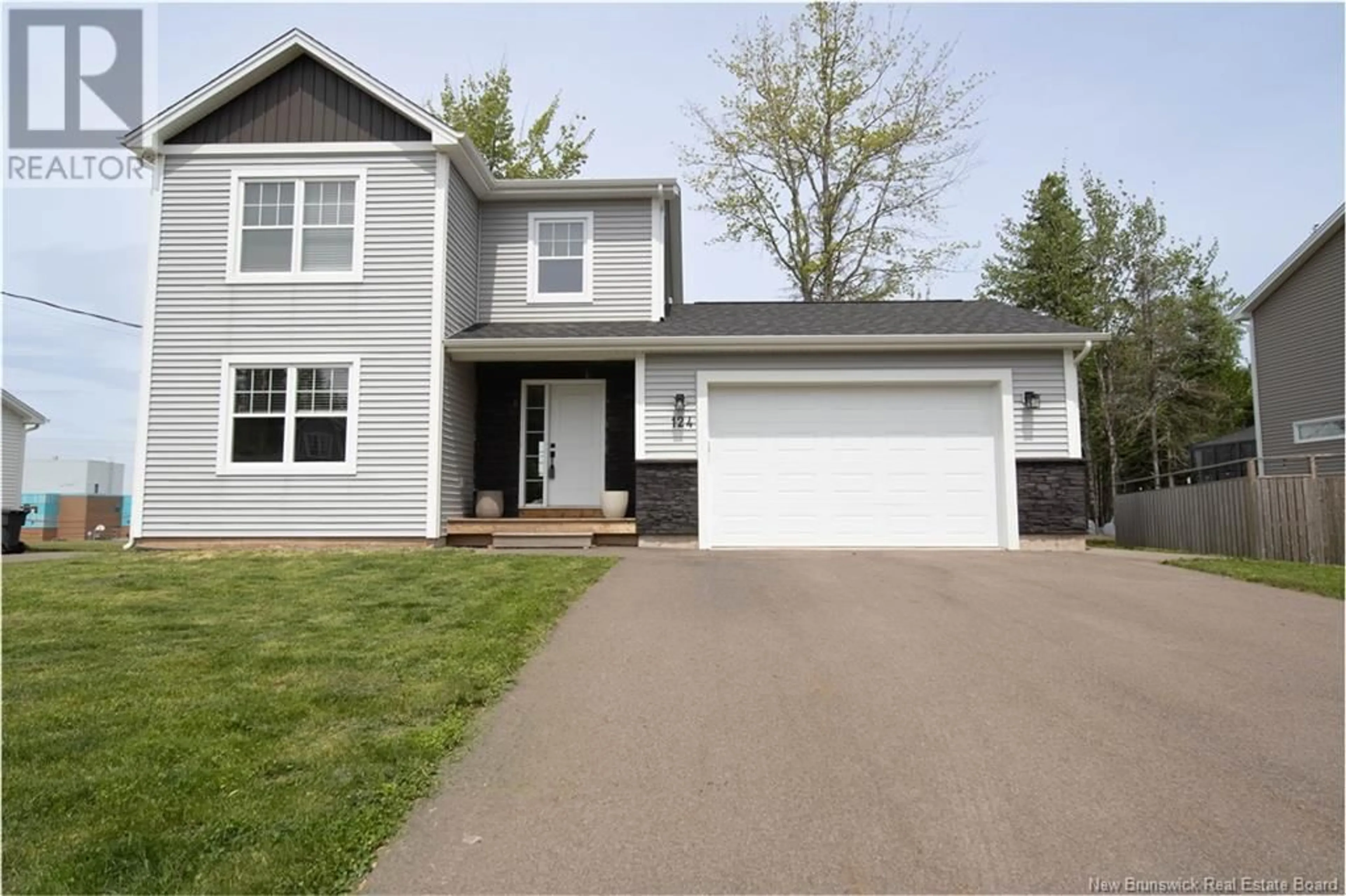 Home with vinyl exterior material, street for 124 DES ELEVES, Dieppe New Brunswick E1A4V6