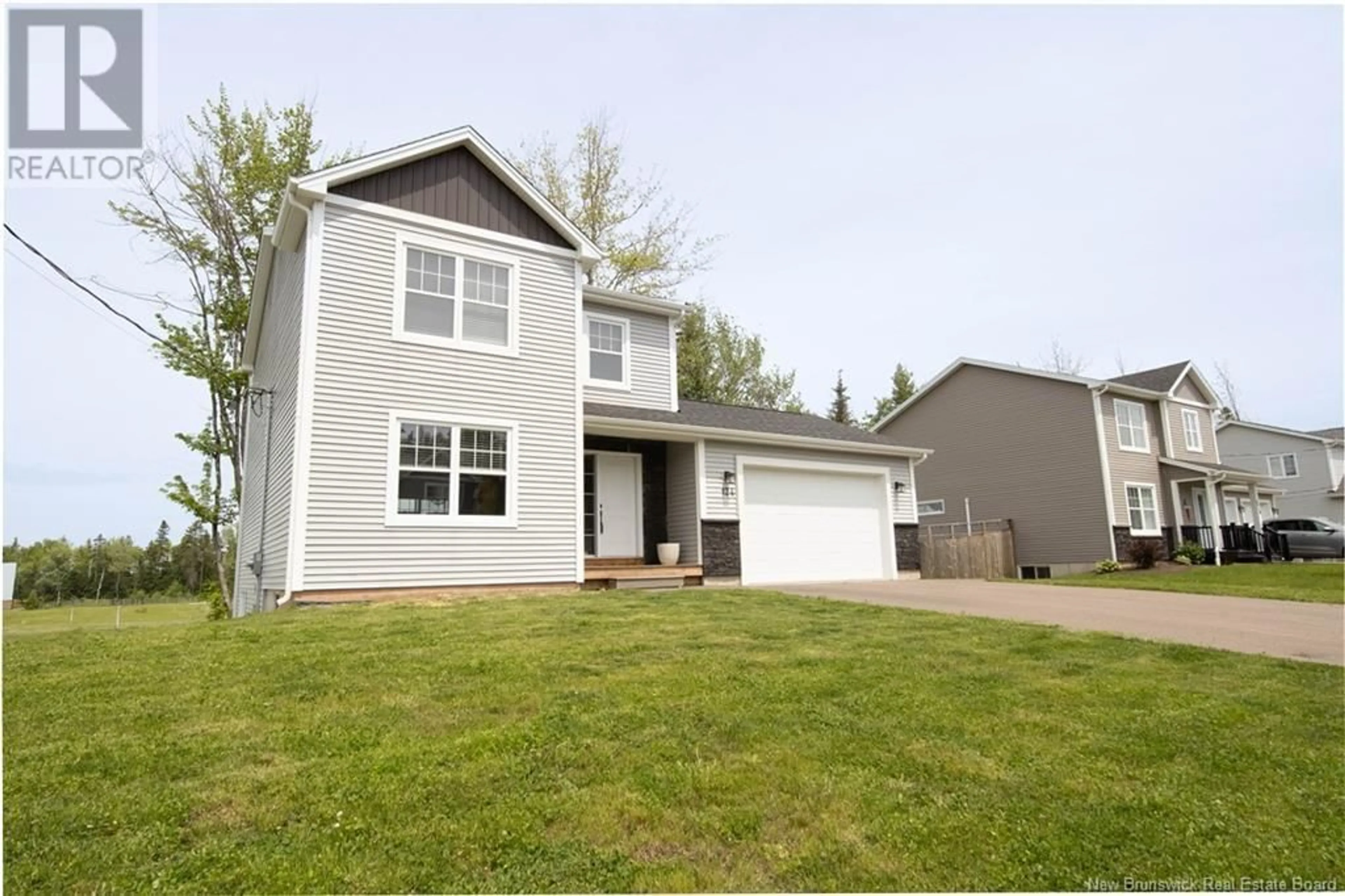Home with vinyl exterior material, street for 124 DES ELEVES, Dieppe New Brunswick E1A4V6