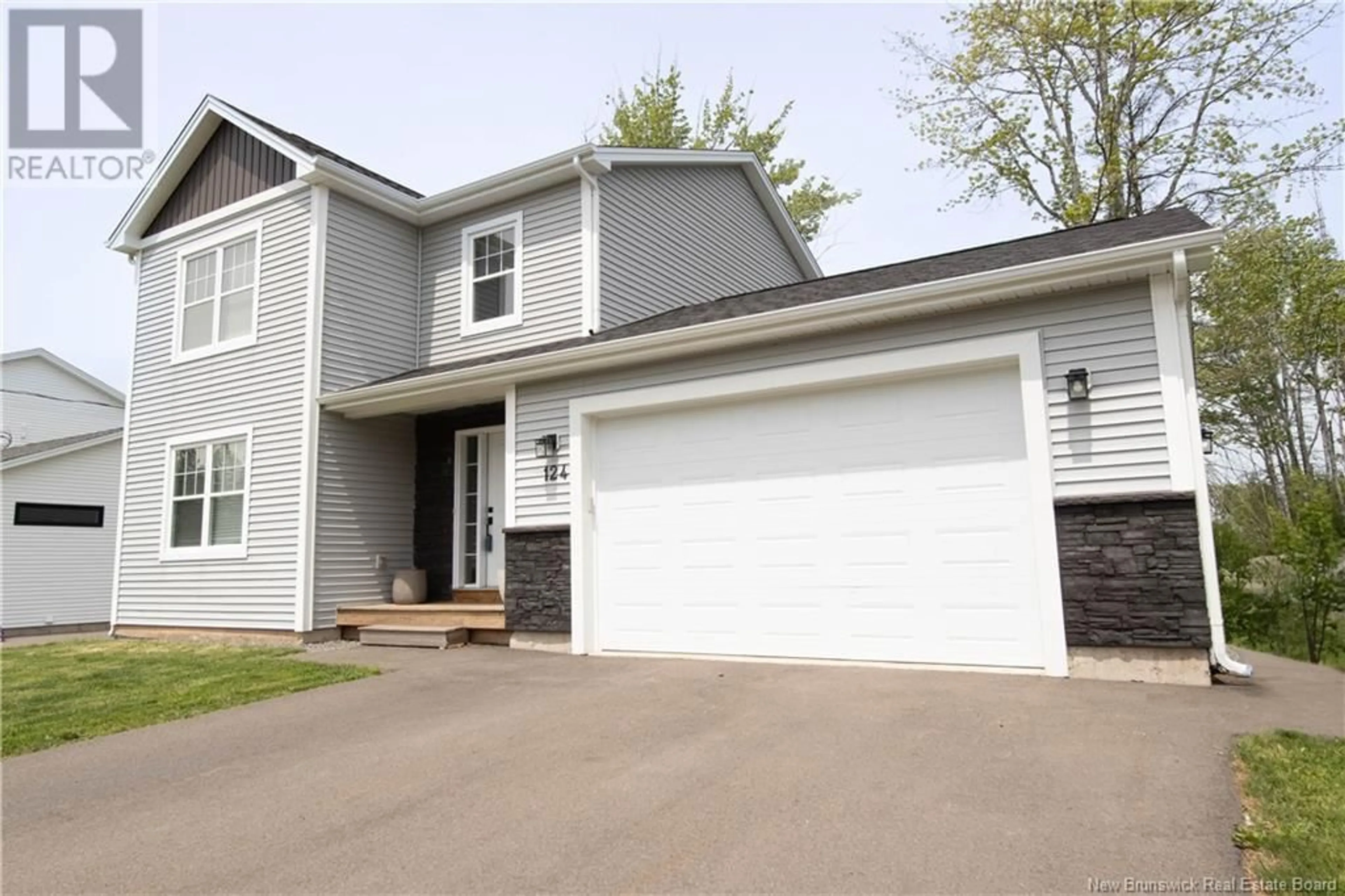 Home with vinyl exterior material, street for 124 DES ELEVES, Dieppe New Brunswick E1A4V6