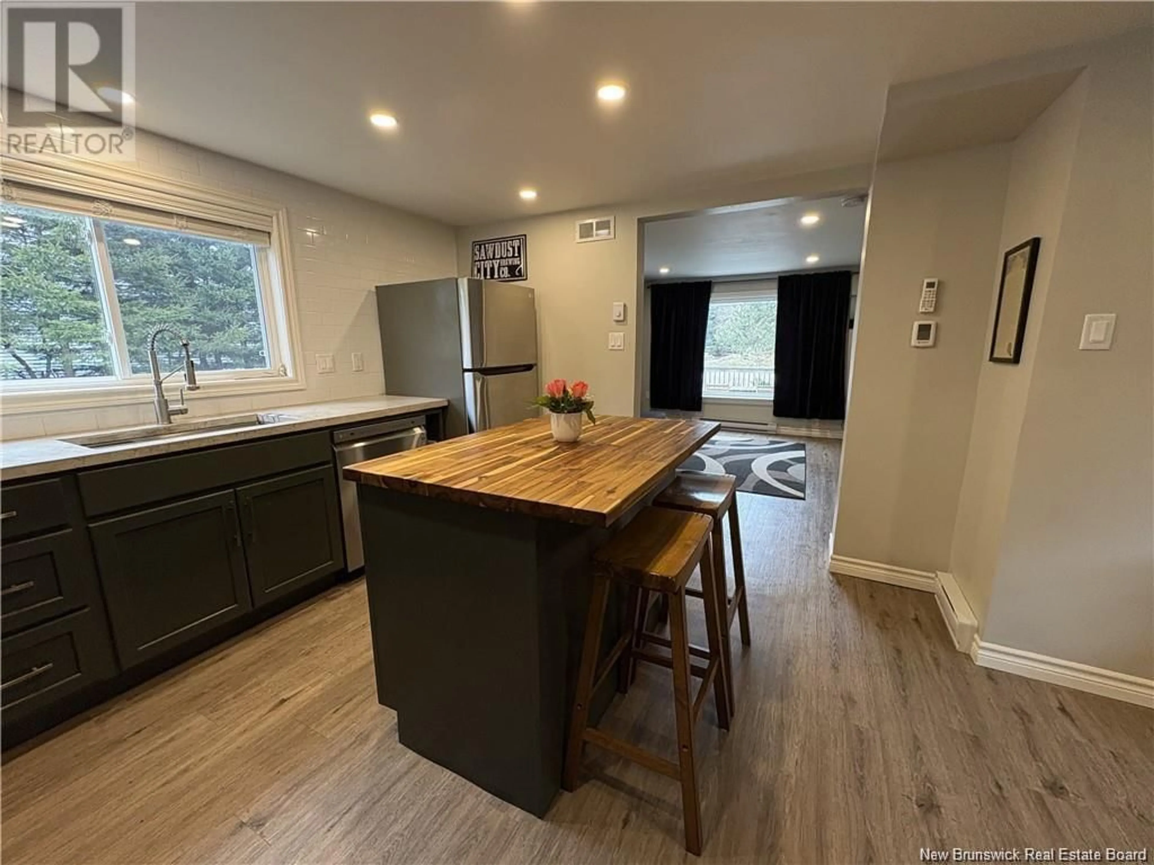 Open concept kitchen, wood/laminate floor for 31 WALKER, Sackville New Brunswick E4L3K4