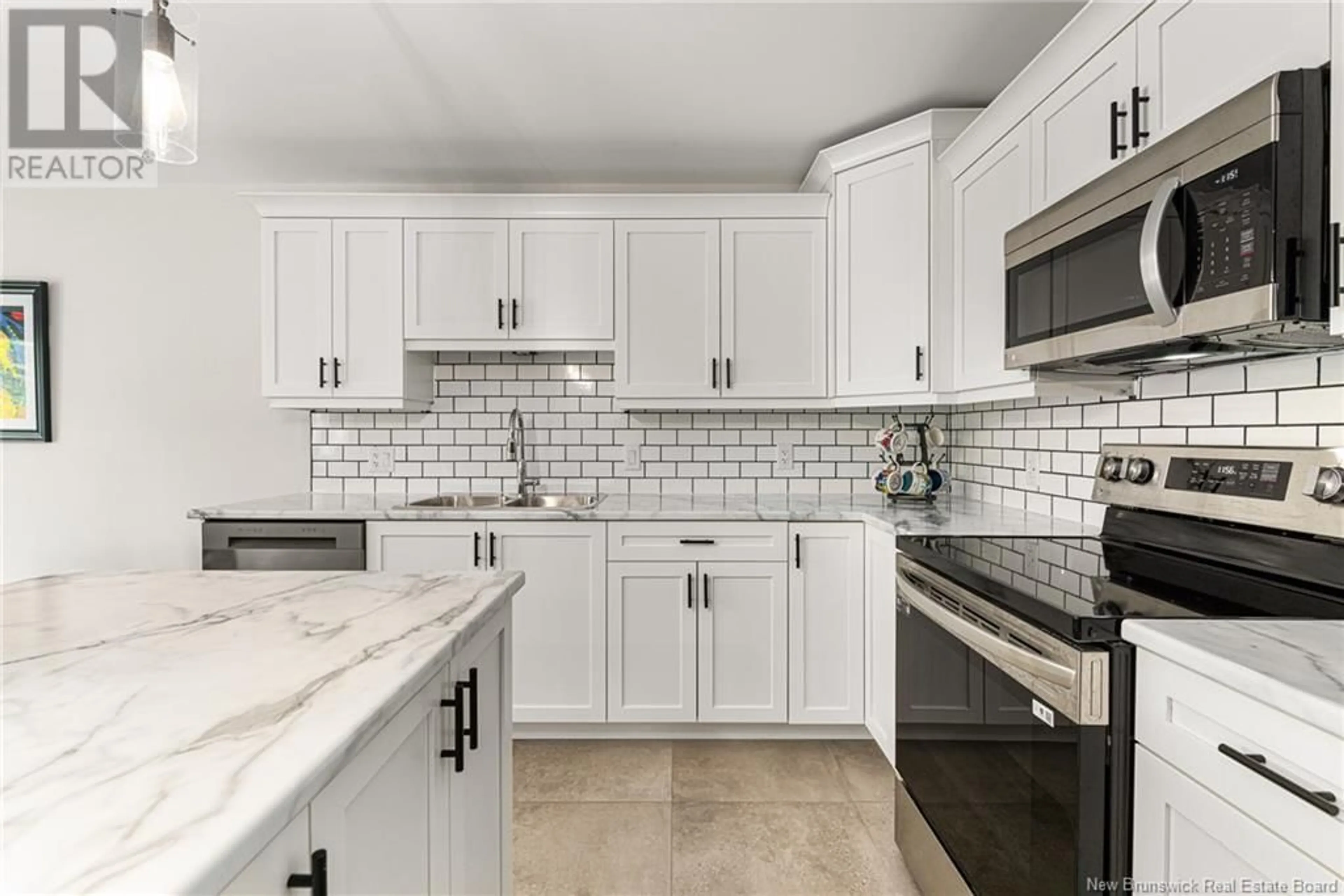 Open concept kitchen, ceramic/tile floor for 28 LOUDUN STREET, Dieppe New Brunswick E1A9X4