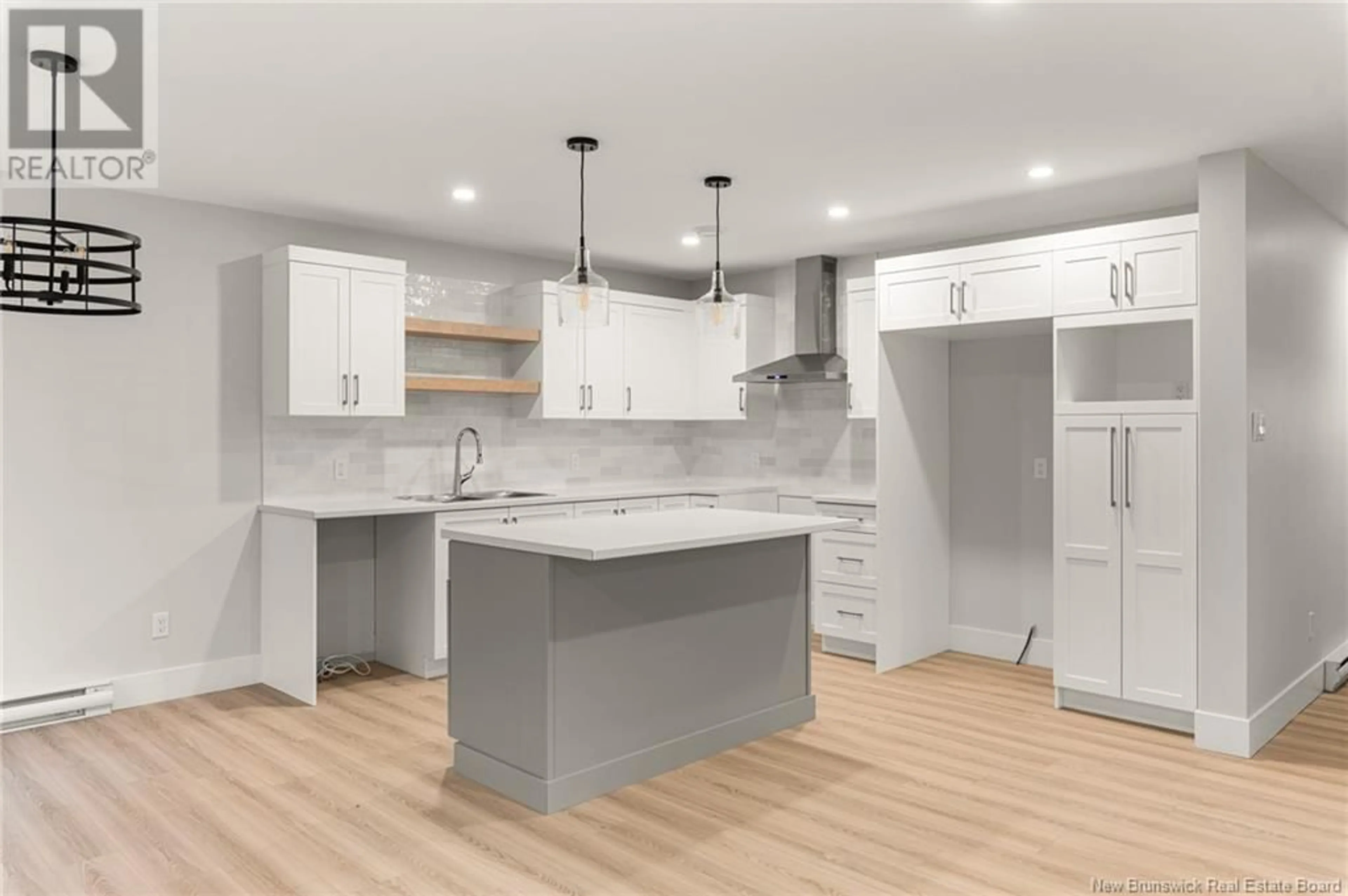Open concept kitchen, wood/laminate floor for 199 TEABERRY AVENUE, Moncton New Brunswick E1G0E8