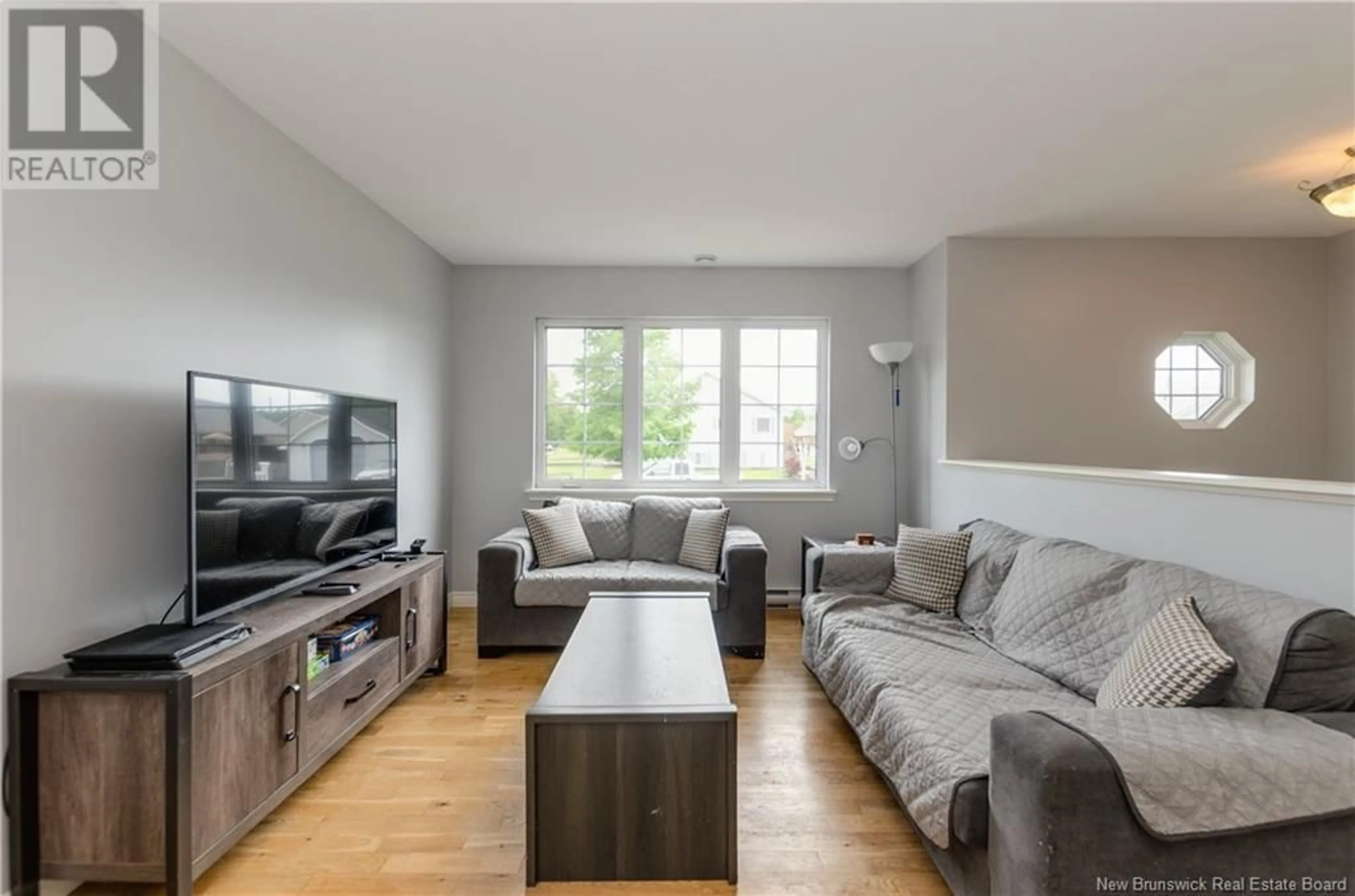 Living room with furniture, wood/laminate floor for 54 PENROSE STREET, Moncton New Brunswick E1E4N9