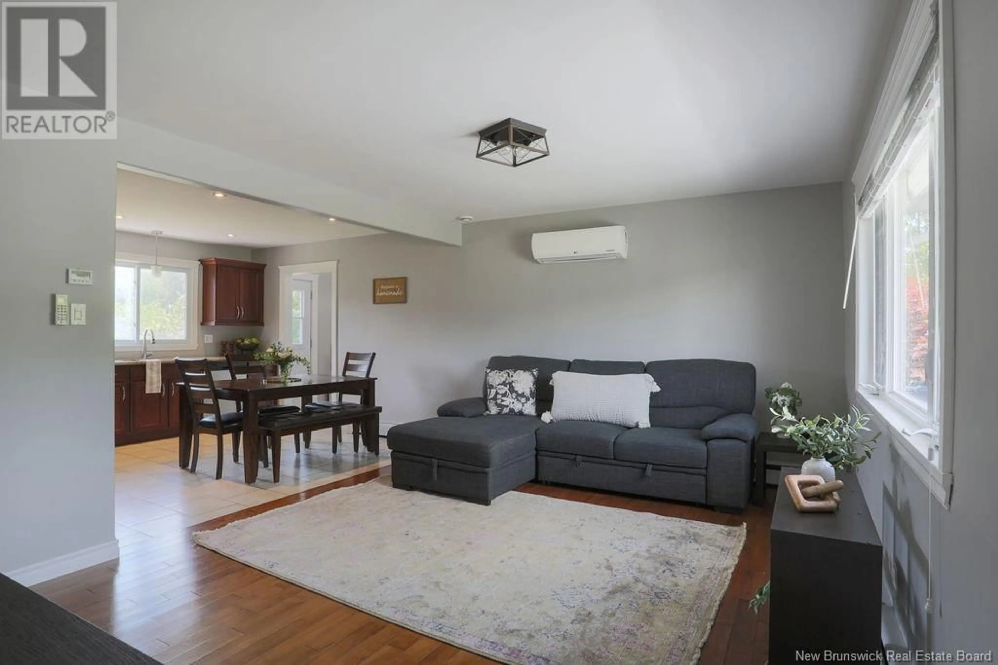 Living room with furniture, wood/laminate floor for 1850 ROTHESAY ROAD, Rothesay New Brunswick E2H1S5
