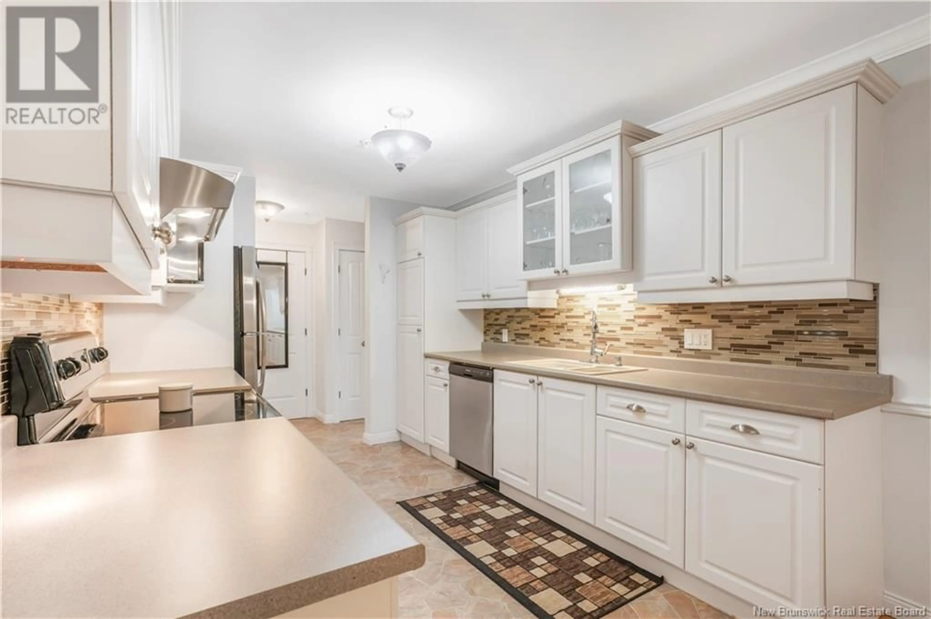 Open concept kitchen, ceramic/tile floor for 107 - 362 CARLETON STREET, Fredericton New Brunswick E3B0C8