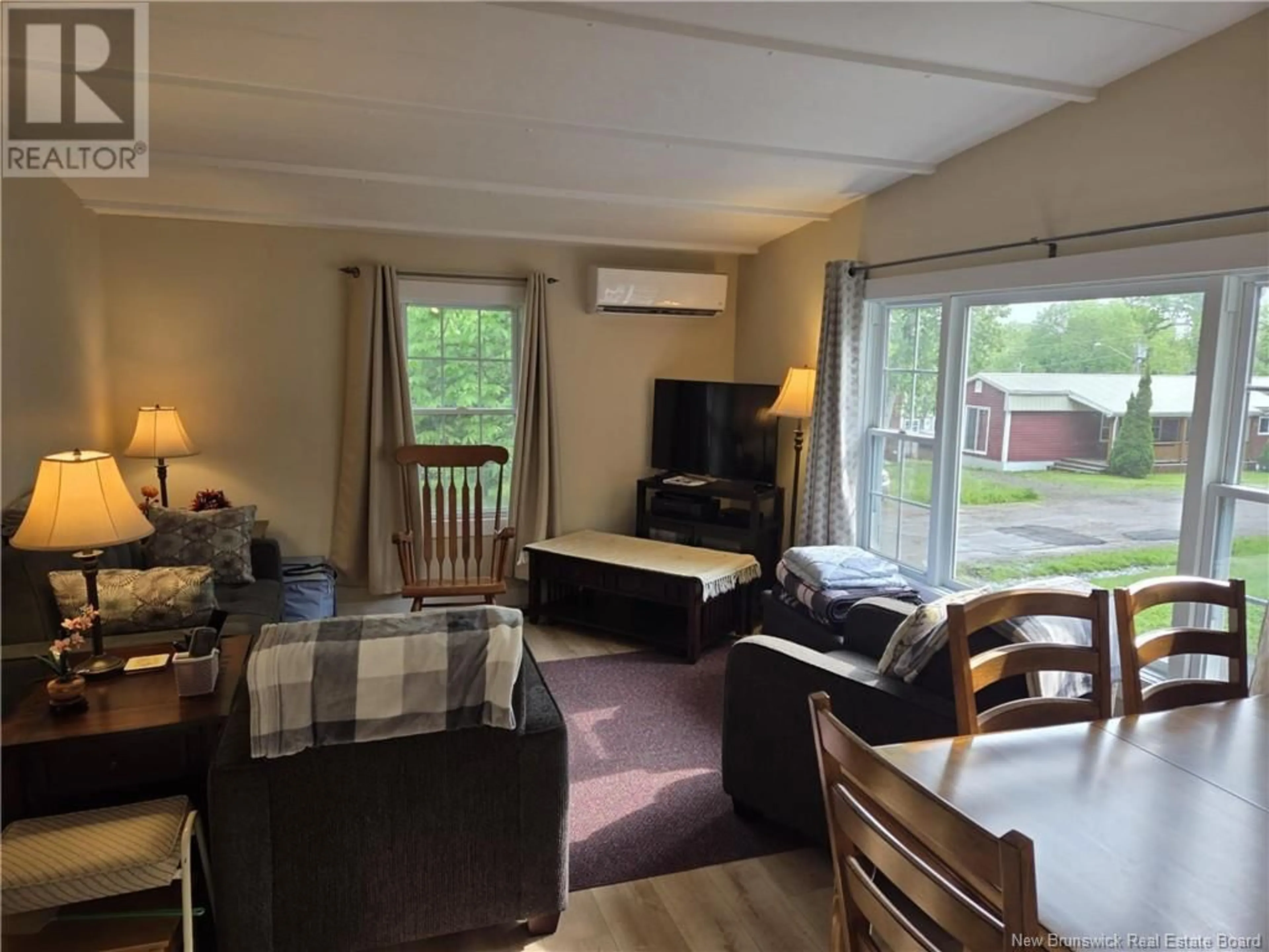 Living room with furniture, wood/laminate floor for 318 GOVERNOR LANE, Fredericton New Brunswick E3B7K9