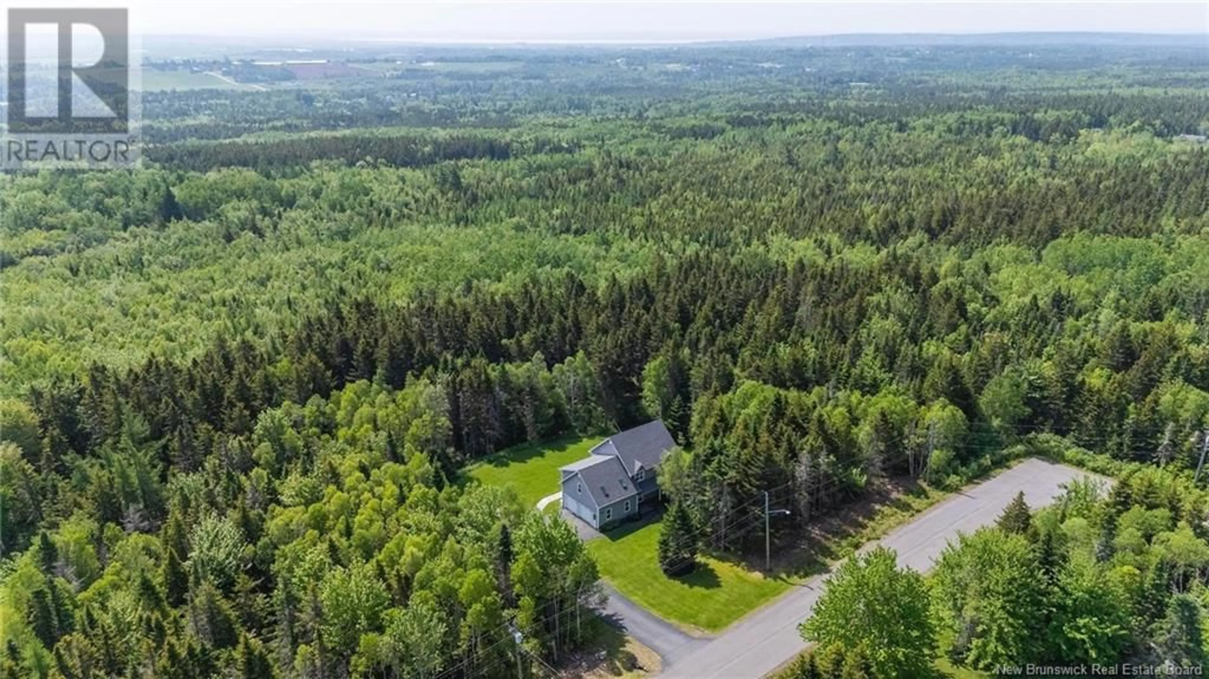 A pic from outside/outdoor area/front of a property/back of a property/a pic from drone, forest/trees view for 46 CARRIAGE COURT, Sackville New Brunswick E4L1B2