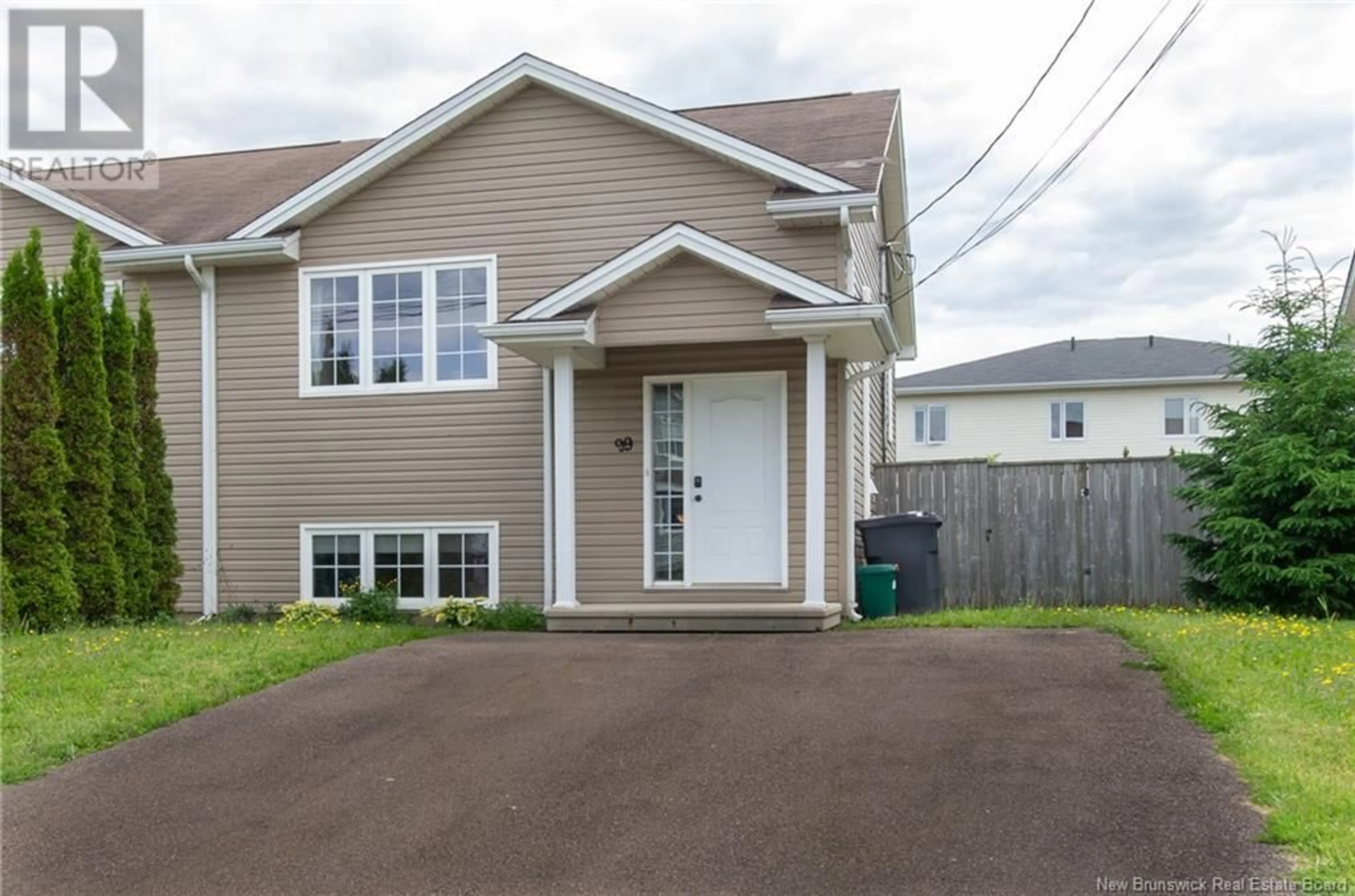 Home with vinyl exterior material, street for 99 JEANNETTE STREET, Dieppe New Brunswick E1A0K3