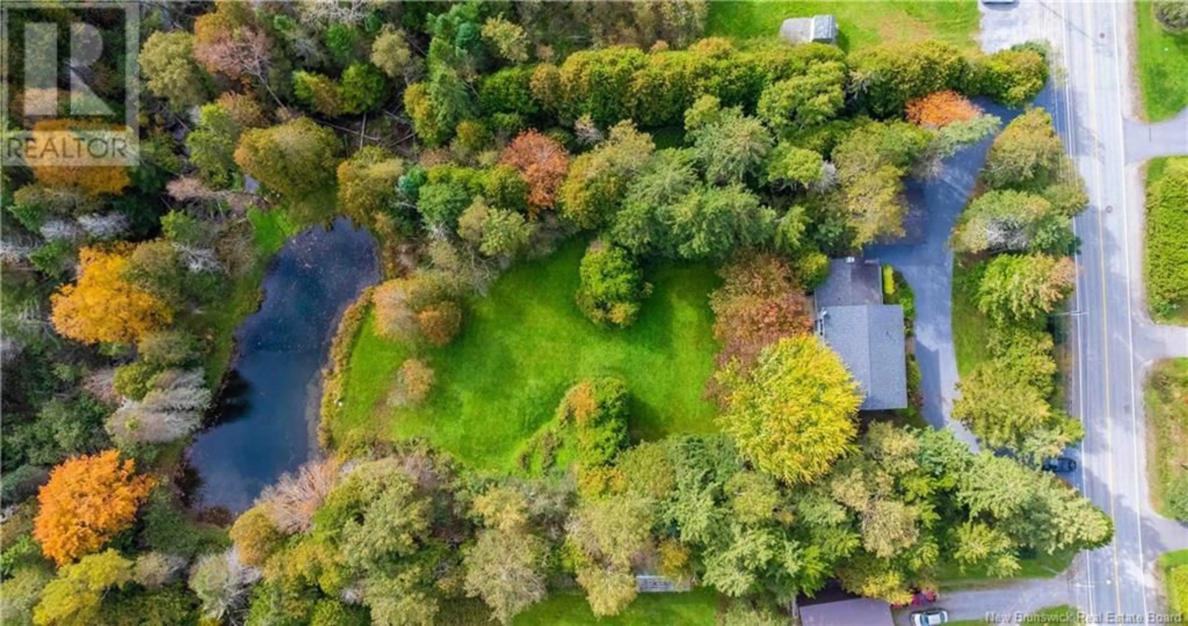 A pic from outside/outdoor area/front of a property/back of a property/a pic from drone, forest/trees view for 704 HAMPTON ROAD, Quispamsis New Brunswick E2G1E9