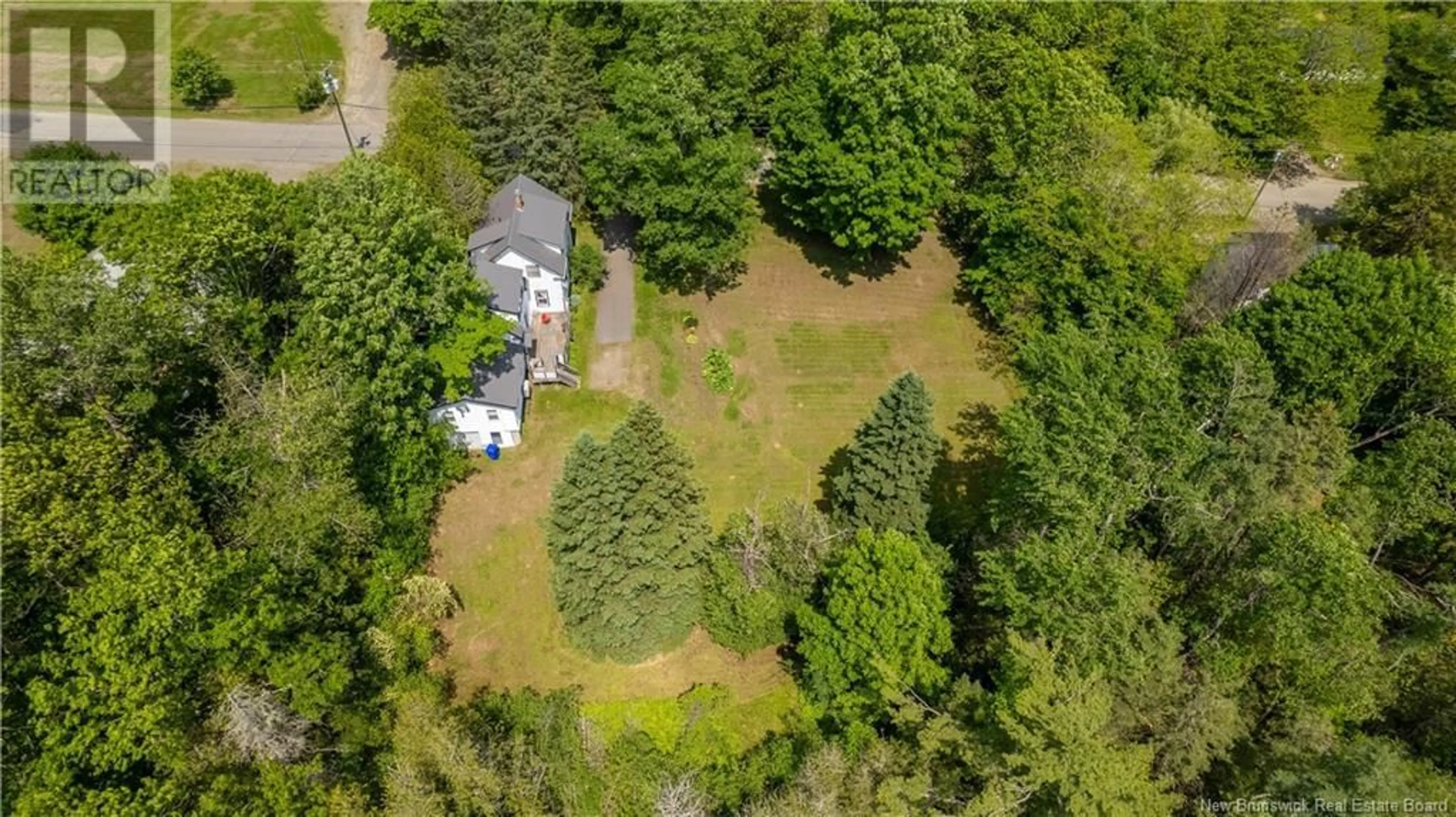 A pic from outside/outdoor area/front of a property/back of a property/a pic from drone, forest/trees view for 46 BOUNDARY STREET, St. Stephen New Brunswick E3L1N8