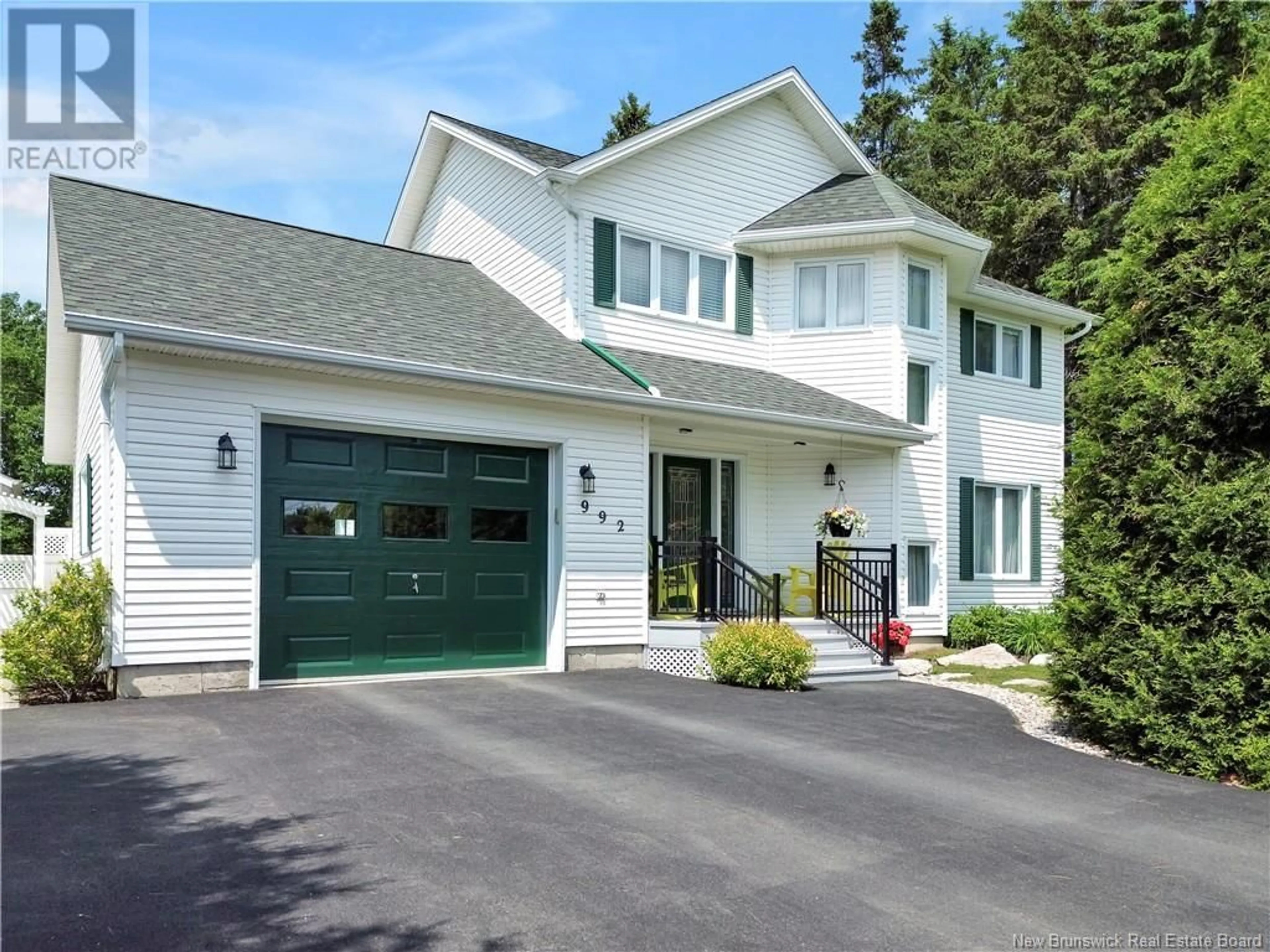 Home with vinyl exterior material, street for 992 RUE DE LA MER, Beresford New Brunswick E8K1H6