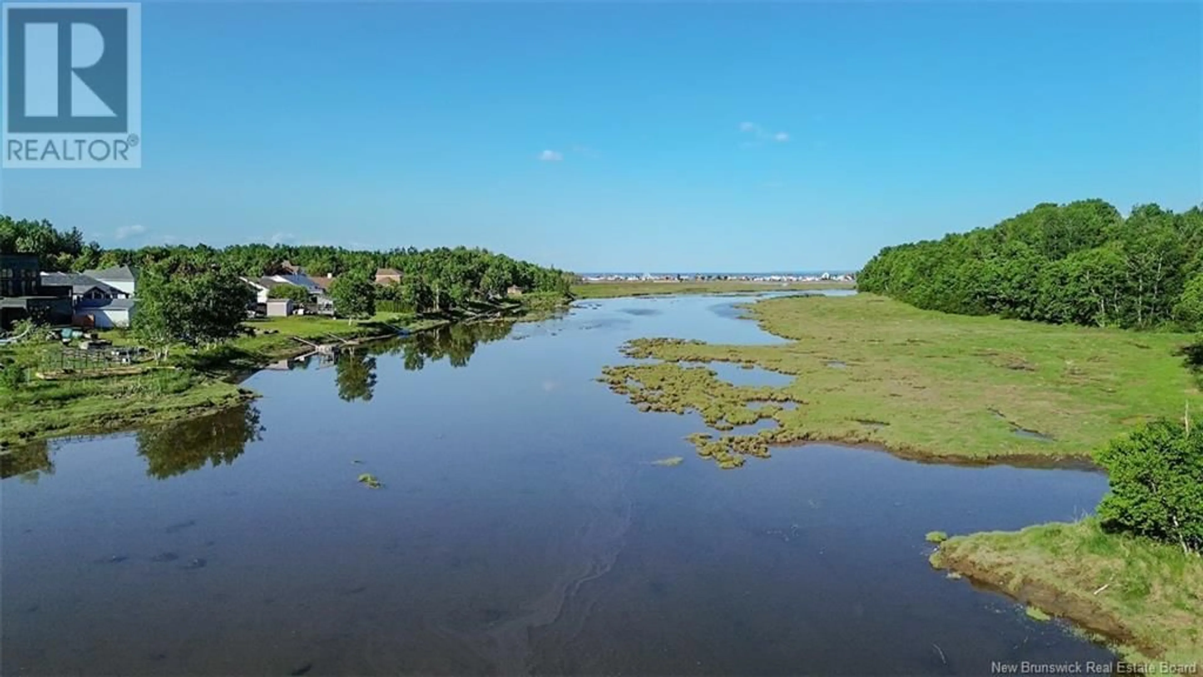A pic from outside/outdoor area/front of a property/back of a property/a pic from drone, water/lake/river/ocean view for 992 RUE DE LA MER, Beresford New Brunswick E8K1H6