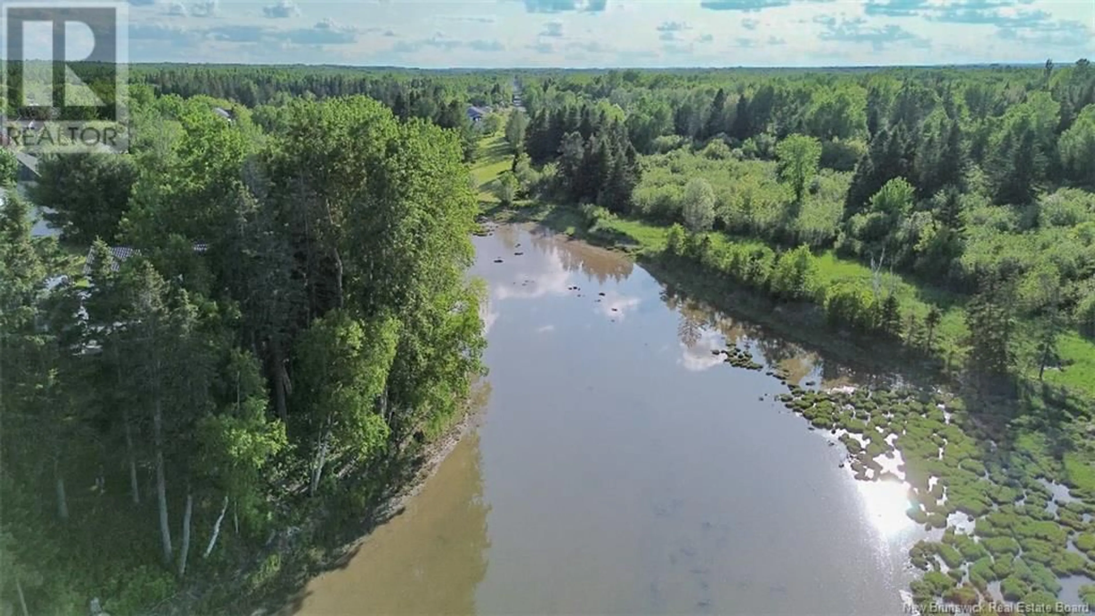 A pic from outside/outdoor area/front of a property/back of a property/a pic from drone, water/lake/river/ocean view for 992 RUE DE LA MER, Beresford New Brunswick E8K1H6