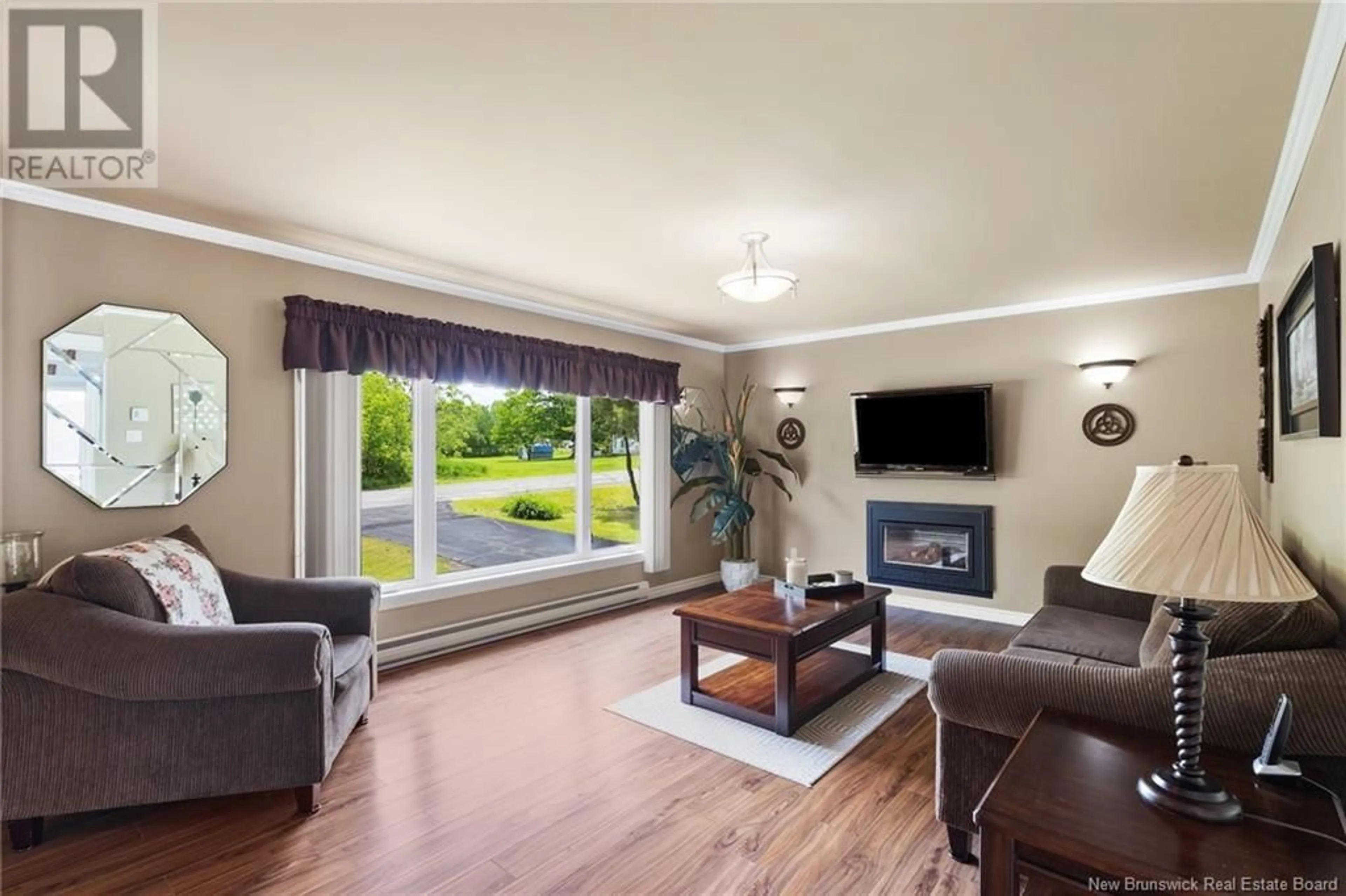 Living room with furniture, wood/laminate floor for 4 WILLIAM STREET, Lincoln New Brunswick E3B8N8